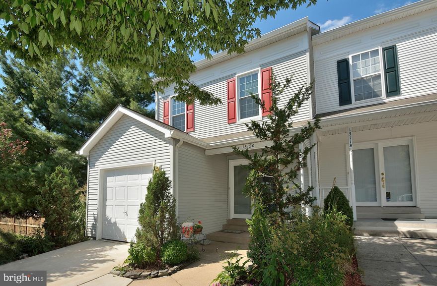 Immaculate end-unit gem w/ garage, front porch, trees. Kitchen boasts new Corian counters, new ceramic tile floor, new stove, new built-in microwave, new dishwasher. New stone back splash. New flooring in upstairs hall bath. Plush carpet and hardwood flooring. Dining area overlooking sunken living room w/built-in shelves + 9 ft. ceiling! Gas fireplace. Unfin. laundry rm. Main lvl. painted.
