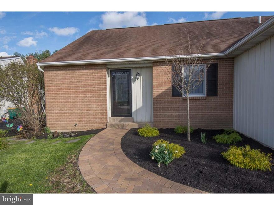 Come tour this completely renovated twin located in The Orchard. Upon entering, it will feel as though you are touring a new sample home. Enter the foyer and instantly see the stunning hardwood floors, to your left is the upgraded kitchen with new stainless steel appliances which include a 5 burner gas stove, new granite counters and new tile floor & back-splash. A pass-thru window makes it easy to oversee both the dining area and the wonderful living room from the kitchen, which is terrific for entertaining. The open living area and dining space offer vaulted ceilings, skylight, new light fixtures, more of those wonderful rich hardwood floors, a floor-to-ceiling brick wood burning fireplace and new French door access to the private back deck, that overlooks the maturely landscaped grounds. Also on this main level, are two spacious bedrooms, a remodeled full bath and a well placed large laundry area/closet, plus very convenient inside access to the 1 car garage. Upstairs features a gracious master bedroom suite with a walk-in closet and a beautifully appointed private bathroom. There is also a useful loft area on this level, currently used as a den...but this area could easily be an office or play room, depending on your needs. The home has been painted from top-bottom inside, all carpeting and wood floors are new, front door and walkway are also new. The driveway allows for more parking, in addition to the garage...and the home even has potential for additional living space in the unfinished spacious basement, but for now, it gives an owner tons of options for any storage needs.  Great location in development with short walk to township park. Conveniently located to major roads, shopping, dining and new Montgomery Township Community Center. You will not be disappointed when you tour this home, so don't wait!