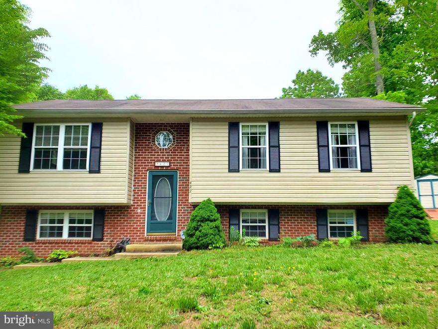 Welcome Home to 427 Buffalo Road. This 4 Bed, 3 Full Bath Split Level Home is Perfectly Laid Out to Accommodate and Enjoy over 2000 sq ft of Living Space Inside.  Open the Sliding Glass Doors Off the Kitchen and Step Outside into a Newly Built ('19) 584 sq ft Screened in Porch and Open Air Deck!  4 Steps More and there is Yard Galore to Run, Play and Enjoy!  With 3 Beds and 2 Full Baths on the Upper Level, the Additional Bedroom and Full Bath are Perfectly Separated in the Lower Level for Guests, an Office, a Playroom and More!  New Stainless Steel Appliances in the Kitchen.  New Carpet Throughout!  There is Parking for 4, but can fit more if needed and the Home is Seated on a Quiet Side Street, minutes from the Front Gate Entry. This Community is Full of Private Usage Amenities, to Include TWO Private Beaches, a Private Lake with Kayak and Small Boat Ramp, Bike Paths, a Full Campground Facilities with Showers and Baths, a Clubhouse, Private Air Strip and Helo Landing area, Garden Plots, Roving Security and More! This Specific Home also is Grandfathered into a Lower HOA Fee, that will pass to the New Owners too! 427 Buffalo Road is Going Live on Friday, May 13th with a Public OPEN HOUSE on Saturday, May 14th from 12-2.  The Sellers are Already Accepting Appointment Requests, so Make Your Appointment Today!