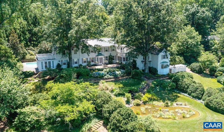 Lovely stone residence in Farmington Country Club with sweeping Blue Ridge Mountain views. Built in 1930 with tasteful additions, this charming and elegant house offers 5 bedrooms, living room, dining room, chef?s kitchen, study, and an orangery. The quiet private 5 acre property includes a two-story guesthouse with kitchen and 1.5 baths, a separate, second, guest house or office with full bath and fireplace, a large, detached garage, pool, koi pond and garden sheds. There are stone terraces walkways, garden walls and fountains. The professionally landscaped grounds with native plantings offer unusual privacy with convenience to town, UVA and the many amenities of the Club: including golf, tennis, pool, fitness center, and fine dining. Primarily one room deep the residence has excellent light and exhibits fine details and great craftsmanship throughout. This is a special property, comfortable, elegant and to be treasured. Close to the Club. .,Painted Cabinets,Fireplace in Living Room,Fireplace in Master Bedroom,Fireplace in Study/Library