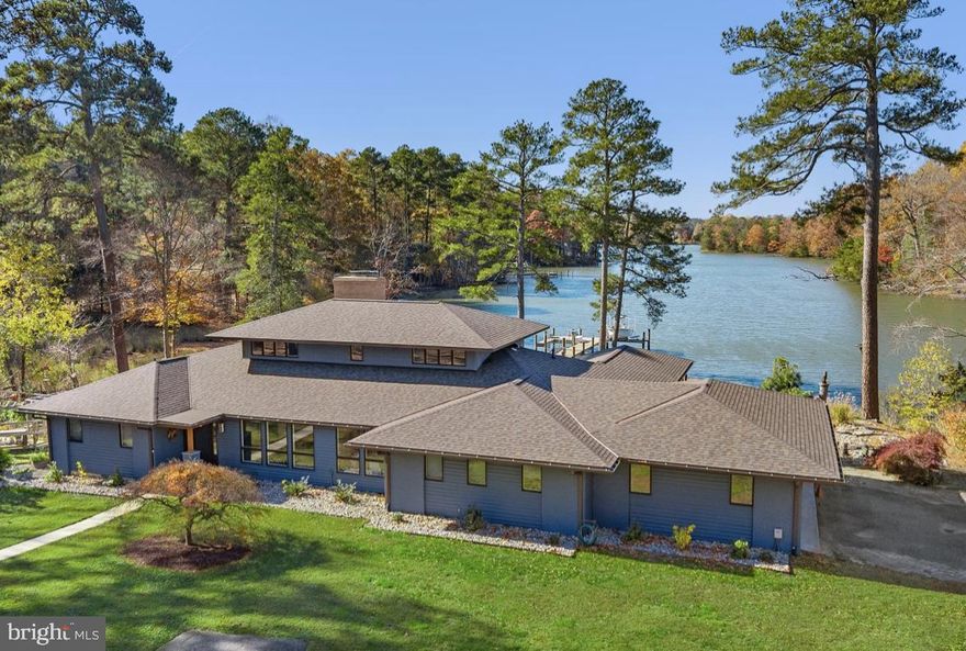 Travel along an enchanting and winding drive, through a park-like setting, across the bridge, to the grand reveal of a prairie-style home boasting coastal-meets-contemporary design elements, all situated in the desirable Bantry community of Easton!   On a private cove feeding into the Miles River, this property offers expansive, breathtaking water views and, the opportunity for boating, kayaking and enjoying the flight of many types of waterfowl (and an occasional eagle!). The property has been completely reimagined by the current owners over the last three years--fully renovated kitchen with stainless appliances, quartzite leathered waterfall island; beautiful pantry; updated owners' suite inclusive of a water-view primary bedroom, sitting room, double- vanity primary bath and walk-in closet (all on the main floor); another large bedroom and flex space/exercise room on the main floor share a full bath; laundry room; and two more bedrooms upstairs (both with water views) which share another full bath. You can't miss the magnificent view from the vaulted-ceiling great room which overlooks the cove on one side and offers a grand brick fireplace for those chilly winter eves on the opposite end. The home also provides a formal dining room, office with built-ins, sitting room with garden-view, large mud room with custom wallpaper, a wood burning stove, and a fun bar/entertaining area with custom elements; half-bath; and an enclosed cedar-lined porch overlooking the water.  New interior doors and flooring throughout.

Updated landscaping, flagstone patios, deck with cable rails, and rock gardens are designed to be low-maintenance.  The deep bronze Anderson doors and many of the windows are new, as is the deep blue siding on the home, a 60 ft pier w/200 sq ft platform dock with 8000 lb boat lift (dock/lift installed by Weems in 2023).  Anderson windows on the water side of the property come with Tru-Scene invisible screens.   Two 5-ton HVAC units and new duct work installed in the last three years.  Beautiful new roof and skylights installed in 2025.

The home is at 8' elevation and not in a federal flood zone. The water depth at the dock is 2-2.5' MLW. Living shoreline with native grasses and flowers.  The 21' center console Sea Hunt boat with a 200 HP Yamaha motor with approximately 100 hours is kept on the dock lift and conveys with an acceptable offer.

The property has numerous large closets for storage, but also a three-car garage at the main house.  A detached three bay garage/workshop with electric, insulation, water and heat, is perfect for a car or boat enthusiast. The sides bays are  two cars deep and the large center bay (functioning as a workshop) that is 35'x35' can store a boat or up to 4 cars.

Easton MD is considered the New Hamptons per Forbes magazine; a culinary mecca and cultural destination featuring museums, shops, theater, art festivals and more! This property will be a short drive to the new regional hospital anticipated for 2028 and is approximately 1.5 hours to Baltimore and Washington D.C..