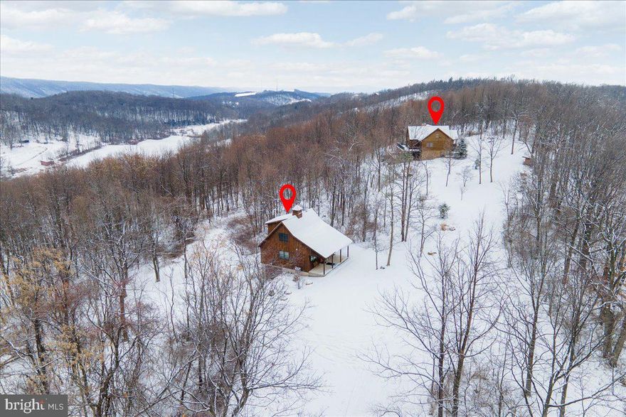 Vacation home or Airbnb portfolio. This property could be broken up into 3 separate Airbnb listings. The main home features 5 bedrooms and 3.5 bathrooms. You can keep the house as one or break it up in two Airbnb listings. The first one would be the main and upper level. Walk into your spacious foyer with exposed logs throughout. Stunning living room with a two story A-frame accent wall with two story windows looking over the valley and mountain ranges. Two story stone fireplace. Upscale kitchen with custom cabinets, updated appliances & barstool seating. Separate dining room area. Half bathroom for guests. Main level owner's bedroom suite with private bathroom with sit-in tub for two and separate shower. Upper landing with room for a small office and two additional bedrooms. Main level private deck off the back or the main level with tons of room for entertaining with breathtaking views. The lower level of the main house could be a completely separate Airbnb listing with a huge family room area, stone fireplace, full kitchen, 2 bedrooms, 2 full bathrooms and a huge patio that covers the entire back of the home.  So you can use the entire home to host one huge family using all 5 bedrooms and 3.5 bathrooms or break it down in two listings and make some extra cash. There is a completely separate house that was recently built by the owners with a huge shop, an active Airbnb listing that is a studio apartment, a front and back porch and lower level garage. So move here, live here and enjoy the space for yourself or this can be a huge money maker with 3 separate Airbnb listings. This property is awesome for all 4 seasons. There are lots of things to do outdoors with hiking trails, you are not too far from two different ski mountains, restaurants, shopping and you are right off the highway. The seller spent over 450K in upgrades which are attached to the listing or can be emailed by request. Please call today for a private tour.