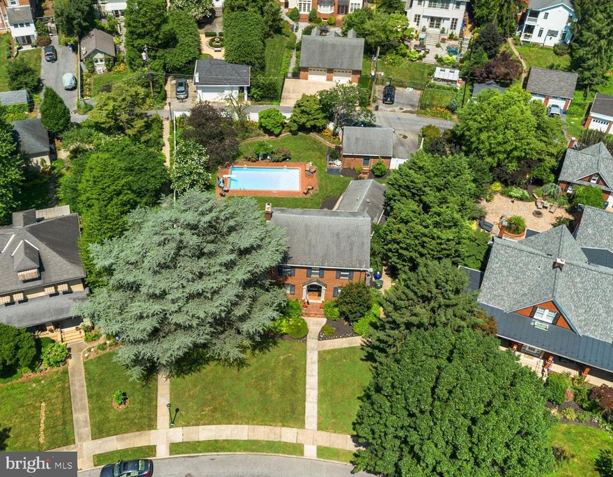 Rare Downtown Frederick Single Family Home on .26 acres with over 4000 sq ft of living, 2 Primary ensuite bedrooms with one on the main level (updated in 2024), this heirloom property is a must see! Accessibility is unmatched, with two wheelchair-accessible ramps on the side and back entrances. Step inside and experience the seamless blend of classic charm and contemporary upgrades—over $150K in recent renovations by the current owner ensure this home is truly move-in ready. The main level features hardwood floors, a cozy gas fireplace, a formal dining room, and a stunning eat-in kitchen with soapstone counters, stainless steel appliances, slide-out drawers, and a bonus pantry. The four-season sunroom, with heated slate flooring and four sliding glass doors, brings the outdoors in and offers tranquil views of the lush, landscaped yard and inground pool.  Abundant in history and modern luxury, this beautifully maintained brick Colonial is an opportunity in one of Frederick’s most desirable neighborhoods. Perfectly situated with direct park views and just minutes from Baker Park and Culler Lake, you’ll enjoy easy access to tennis and bocce courts, playgrounds, picnic areas, dog park, and a vibrant calendar of community events. 
The home’s flexible layout is ideal for multigenerational living or aging in place, with two primary ensuite bedrooms—one on the main level, fully updated in 2024 with heated floors, a jacuzzi tub, dual sinks, lighted mirrors, plus a new combo washer/dryer for ultimate convenience. Upstairs, the second primary suite features heated marble floors, dual vanities, a walk-in tile shower, two spacious closets, including a cedar closet. 
Two additional bedrooms and a brand-new hall bathroom (2025) with a great shower complete the upper level. The finished lower level offers a brand-new basement (2025) with wall-to-wall carpet, brand new boiler, new water heater, and a second laundry area (washer 2013, dryer 2019). The finished space is all ready for a home office, rec room, and/or craft space. 
Enjoy year-round comfort with separate AC zoning for the main level and upstairs, central heat, and new LED lighting strategically throughout. Outdoor living is a dream: the fenced rear yard features an inground pool maintained by Propools (2025), a hot tub, a pergola, a koi pond, and one of Frederick County’s oldest Lebanon Cedars, complete with a commemorative plaque. The property includes a 2 car detached garage, with an additional private off-street parking for 3 more cars. There is ample space for storage either using the outdoor shed or the clean empty attic. 
This home is more than just a place to live—it’s a lifestyle. Enjoy beautiful views from every window, original stained glass, tasteful landscaping, and the warmth of a close-knit, friendly community. Schley Park, maintained by the city but cared for by neighboring owners, creates a quaint, private atmosphere while keeping you close to dining, shopping, and all that downtown Frederick has to offer. Don’t miss your chance to own this extraordinary property—schedule your private tour today and discover why this is the perfect place to call home. *Check out the Video & Floor Plan Walkthrough*