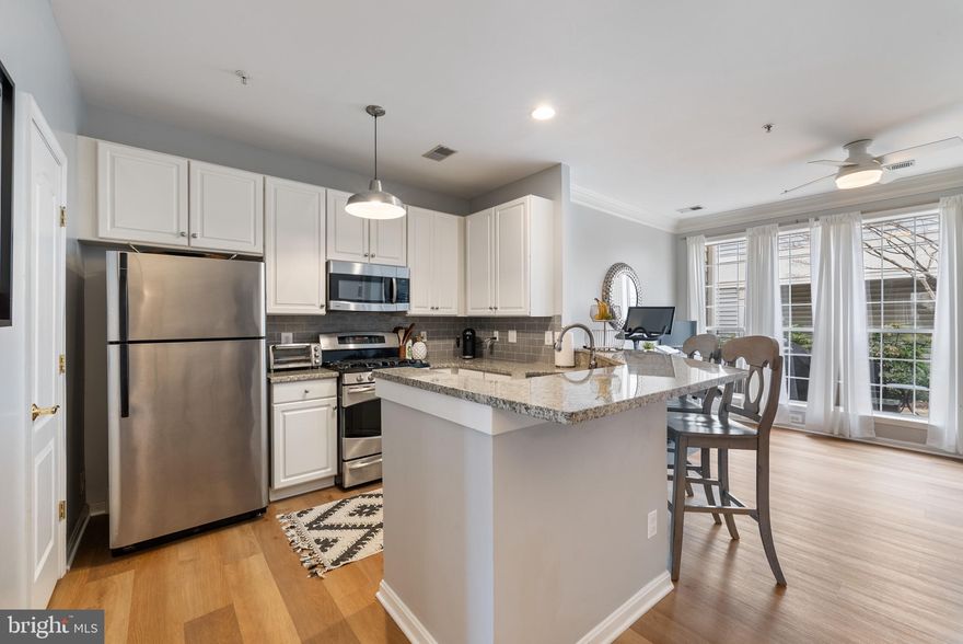 Experience the perfect combination of charm, modern updates, and prime location in this move-in-ready 2-bedroom, 2.5-bath condo in highly sought-after Fairlington! Thoughtfully designed with stylish finishes and smart upgrades, this home is a true gem.

Step inside to an open and airy main level featuring hardwood floors, elegant crown molding, and soaring 9’ ceilings. The inviting living area, complete with a cozy fireplace, offers the perfect space to relax or entertain. A refreshed half bath adds extra convenience. The beautifully updated kitchen boasts sleek granite countertops, stainless steel appliances, ample cabinet space, and a bright dining area—ideal for both everyday living and hosting guests.

Upstairs, two generously sized bedrooms each feature a private en suite bath. The primary suite has been tastefully updated with modern tile, a frameless glass shower, granite countertops, and stylish fixtures, along with a spacious walk-in closet. A full-sized laundry area and additional storage enhance the home’s functionality.

Step outside to your private patio, a peaceful retreat perfect for enjoying morning coffee or unwinding in the evening. The home also includes one assigned parking space and plenty of guest parking.

Located just off I-395, this home offers unbeatable convenience with easy access to Washington, DC, the Pentagon, Amazon HQ2, Reagan National Airport, and Old Town Alexandria. Walk to neighborhood favorites like St. Elmo’s Coffee, Ramparts Tavern & Grill, Great Harvest Bread Co., and Greenstreet Gardens. Outdoor enthusiasts will love being just minutes from Chinquapin Park and Recreation Center. With multiple bus stops nearby and metro stations just a short ride away, commuting is effortless.

This beautifully updated home offers incredible value in a fantastic location—schedule your showing today before it’s gone!