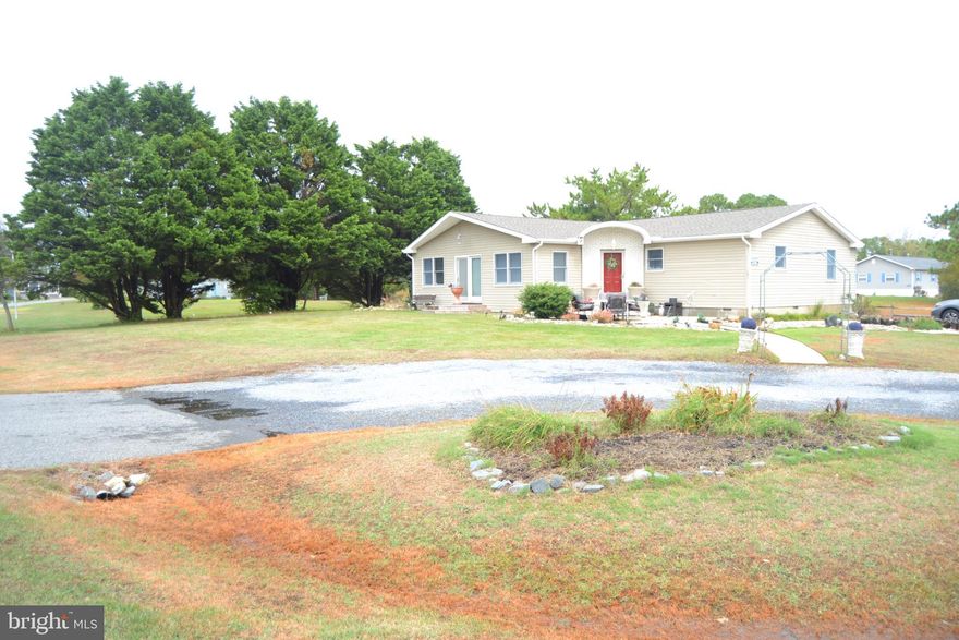 No modular or double-wide here! This beautifully renovated 3-bedroom, 2.5-bath ranch rests on an oversized corner lot in the highly sought-after Pot-Nets Coveside community. From the roof to the crawl space, every inch of this home has been updated.  Step inside to discover soaring cathedral ceilings, a gourmet kitchen featuring a massive center island with quartz countertops, and sleek stainless-steel appliances. The private in-law suite offers its own entrance and dedicated driveway���perfect for guests or multi-generational living.  All major systems are new, offering peace of mind for years to come. While ground rent applies, the community amenities make it feel like resort living at its best—pools, marinas, beaches, dining, and more!  Come experience the good life in Pot-Nets. This is a must-see home—schedule your tour today!