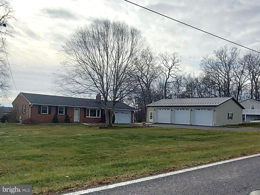 A great opportunity to own this cozy brick Ranch style home  on 0.87 acre country lot.  The owner replaced the roof in 2018, new HVAC system in 2021, remodeled and enlarged kitchen in 2023, new driveway  and concrete pad in 2022, and added 3 car heated detached garage and workshop in 2022.  Nicely  landscaped,, fenced backyard.  No HOA - No City Taxes.