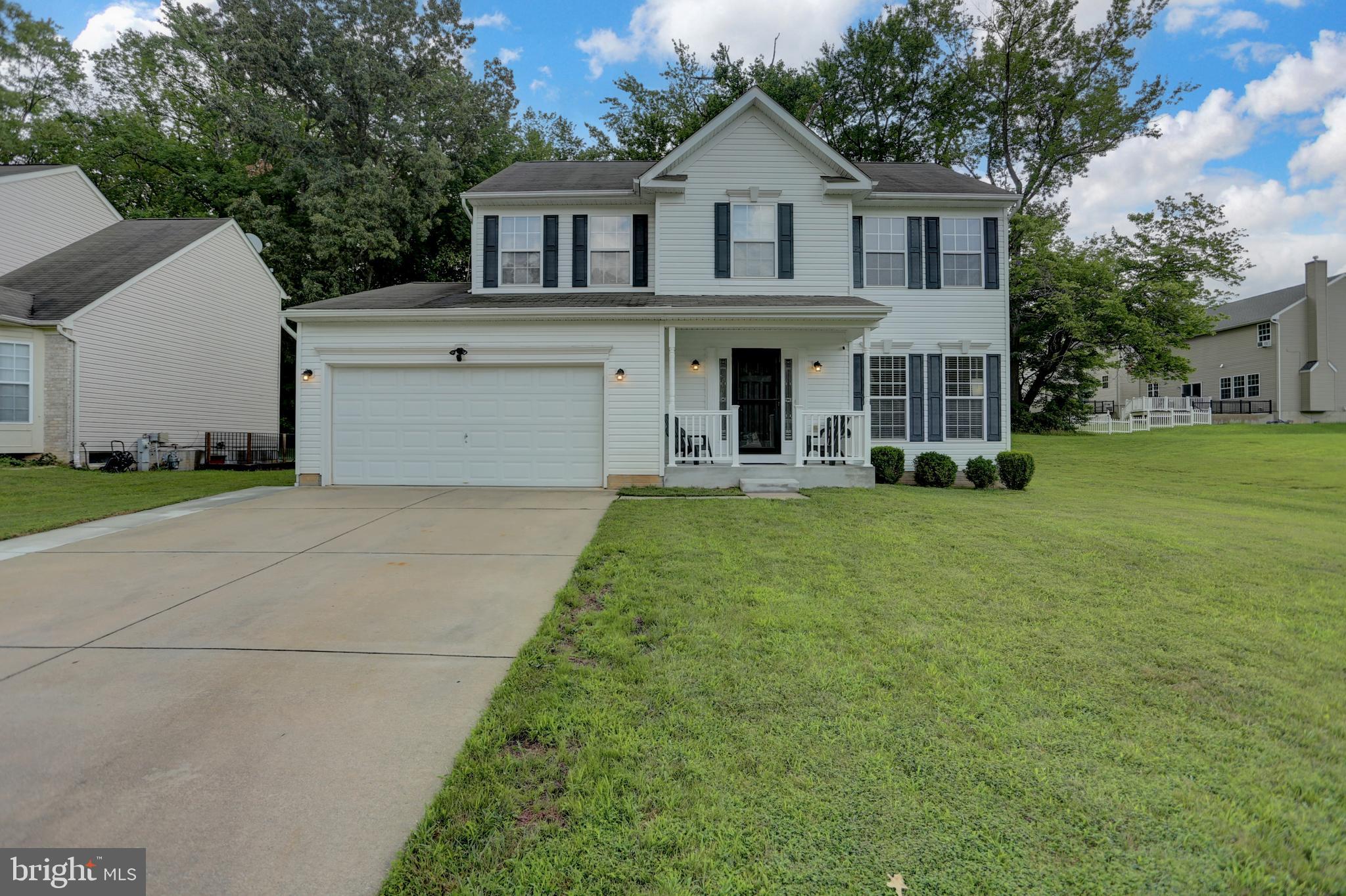 Welcome to 127 William Powell Court, located in the Chapel Crossing Community. This spacious 4-bedroom, 3.5-bath Colonial is perfectly situated on a level lot at the middle of a quiet cul-de-sac street. Step inside to an open and inviting main level featuring a beautifully updated kitchen with a large island breakfast bar - perfect for both casual dining and entertaining. The kitchen flows seamlessly into a generous family room with a cozy fireplace, and sliding doors lead to a large, covered patio, ideal for outdoor gatherings year-round. A separate dining room adds a touch of elegance for more formal occasions. Upstairs, the primary suite offers a true retreat with a walk-in closet and a luxurious en-suite bath, complete with a soaking tub, dual vanities, and a separate shower. Three additional bedrooms and an additional full bath provide ample space. The finished lower level expands your living space with a recreation room, an additional finished room perfect for a home office or exercise area, and an additional full bath. There are numerous updates throughout, including a whole-house generator for added convenience and peace of mind. Located near military bases, major highways, and a variety of shopping options, this home combines comfort, location, and value.