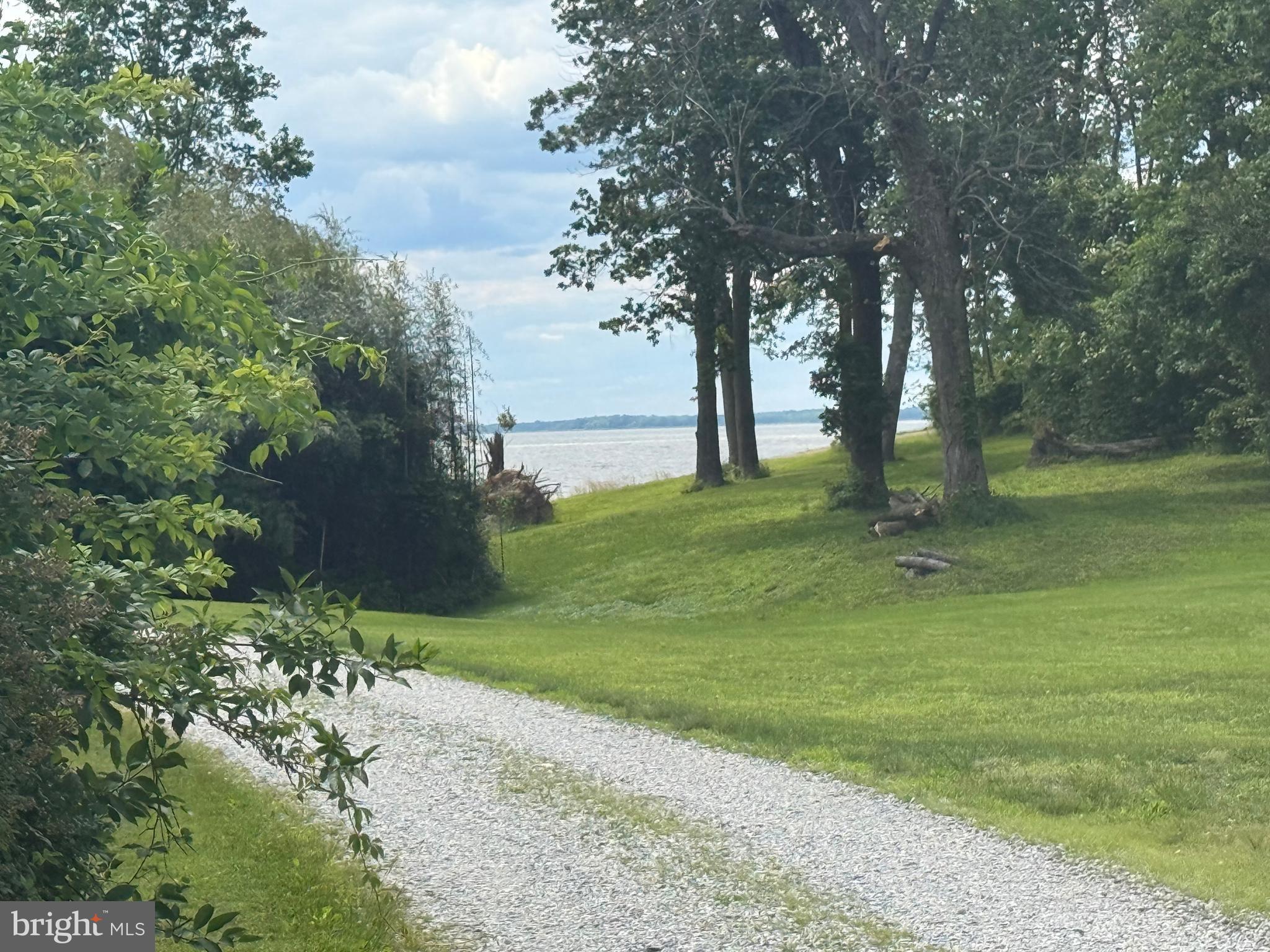 Major price adjustment for an adorable cottage in Chesapeake Haven on a gorgeous triple lot, located a block from the beach entrance. Peek a boo view of the bay-view could be improved!
Property has 2 parcels, 08 01 023225 Lot #4- .1493 acres house is on & 08 01 023233 Lots #5&7 .287 acres. Being sold as - is.
Come use for the summer and take your time fixing it up - great lots, great location.