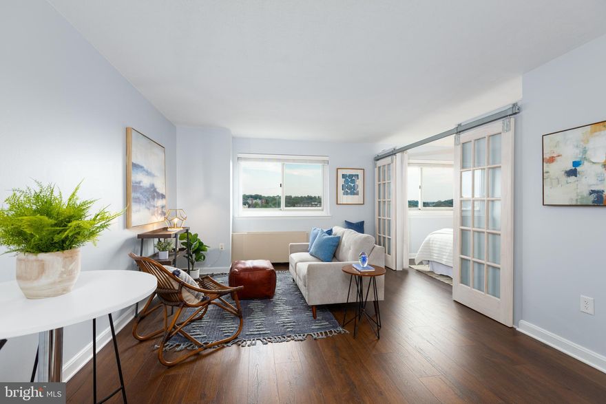 This beautifully updated home is located on the 12th floor of the sought-after Parc East condominium community and is walkable to Shirlington shops & restaurants! This condo provides incredible value with gorgeous sliding glass doors creating a designated bedroom space, a condo fee including all utilities, a deeded storage unit and parking included. The main living area is modern, inviting, and spacious with ample natural light shining on to the recently updated flooring, light grey walls and open layout. The oversized primary closet and entry-way closet, provide plenty of storage along with great space in the bathroom vanity, bathroom shelving and kitchen cabinets (and not to mention the included garage storage unit.) The kitchen hosts gas cooking, granite countertops and newly installed stainless steel microwave. Both trash and laundry facilities are located on every floor for your convenience.
WHAT MAKES THIS COMMUNITY STAND OUT? With low, stable condo fees ($336 monthly), all utilities included, parking lot for residents only, an upscale renovated lobby and 24/7 concierge the Parc East community is absolutely perfect. The association is pet friendly and the amenities include swimming pools, parking lot, basketball courts, tennis courts, picnic tables, exercise rooms, laundry facilities, walking trails and beautiful landscaping.
WHAT MAKES THIS LOCATION STAND OUT?  Easy access to 395, National Airport, Pentagon and Amazon HQ2.  Walkable to Shirlington shops and restaurants and just minutes to Old Town, Arlington neighborhoods and downtown DC. DASH Bus stops are also conveniently located within the community.