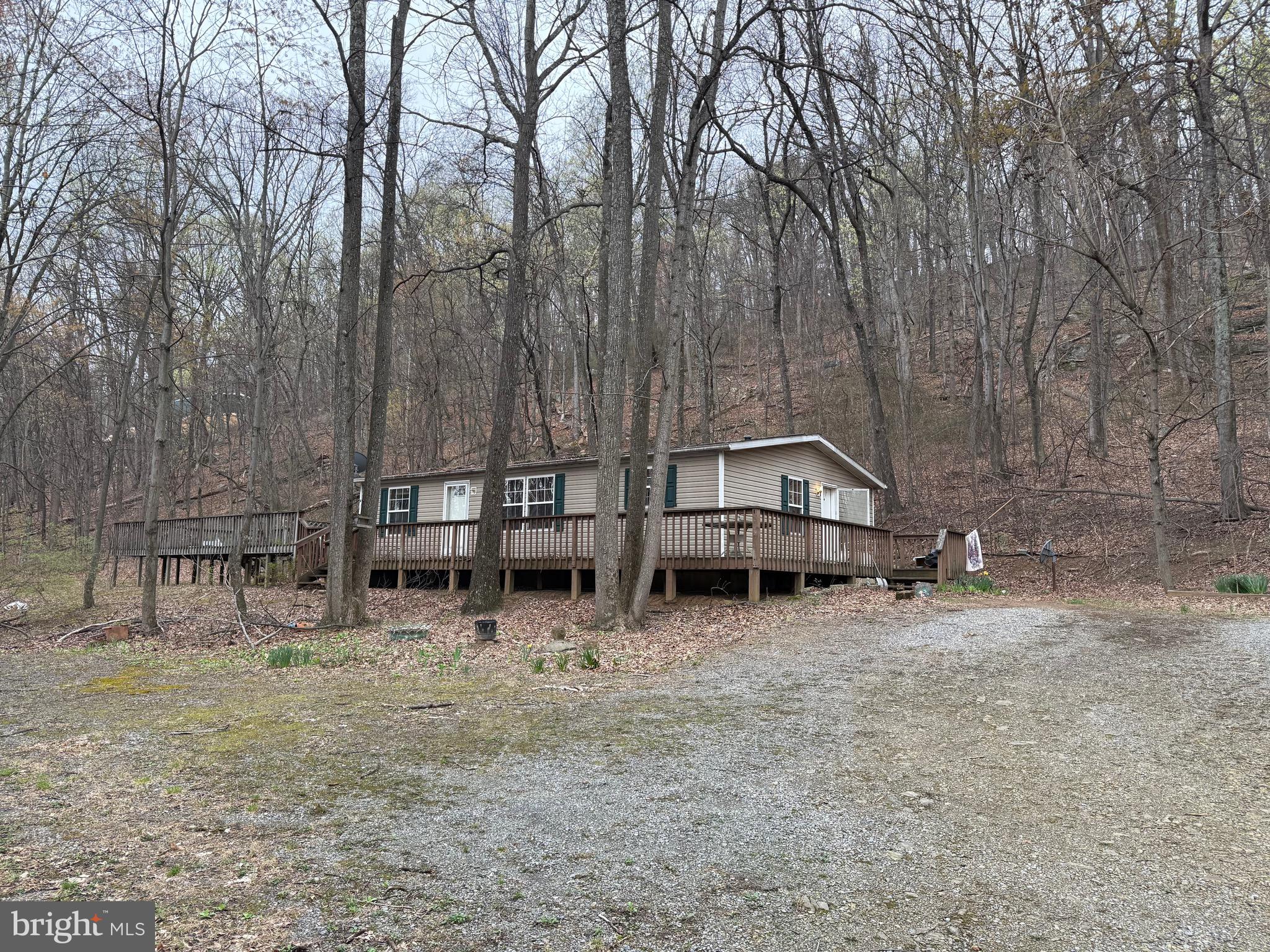 11.22 Unrestricted Acres with well and septic. Enjoy the private location! This doublewide home on a crawlspace needs someone to love it. Being sold AS IS to a cash buyer!