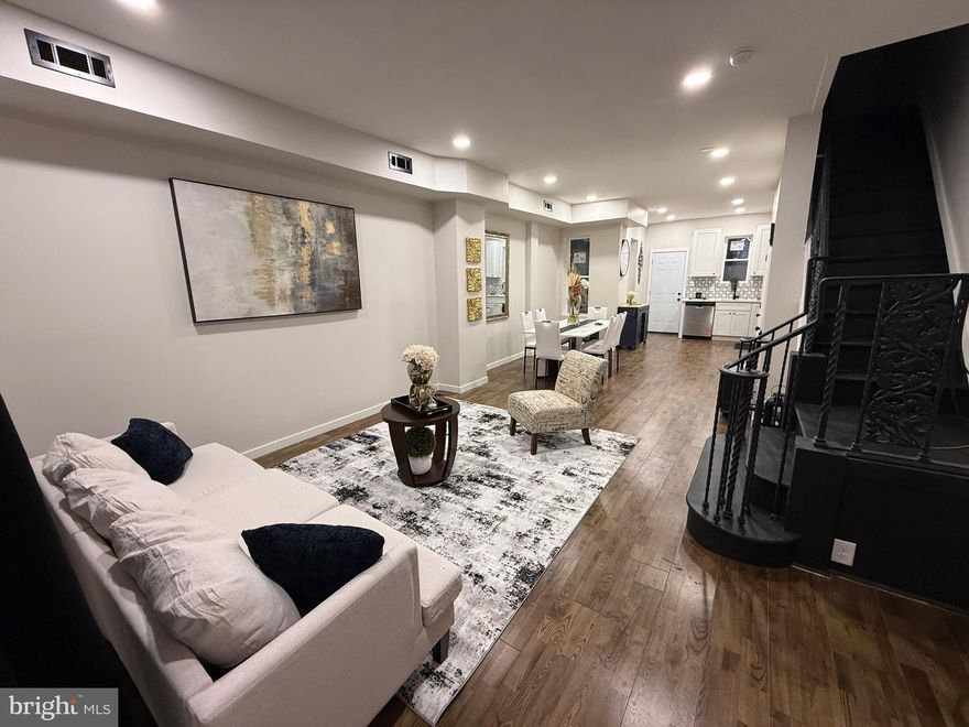 Beautifully renovated home—fresh on the market and waiting for its next owner. From the moment you walk in, you’ll notice the modern recessed lighting, expansive new windows, and hardwood flooring that flows seamlessly throughout. The open-concept living and dining area connects effortlessly to a beautifully renovated kitchen featuring quartz countertops and premium appliances. Upstairs, you’ll find three generously sized bedrooms and a fully redesigned bathroom complete with a new vanity and full-size tub.  Perfectly situated just blocks from City Avenue and Fairmount Park, this home puts you within easy reach of Saint Joseph’s University, shopping, dining, and major sports venues. Enjoy effortless commuting with quick access to I-76, US-1, and MLK Drive.