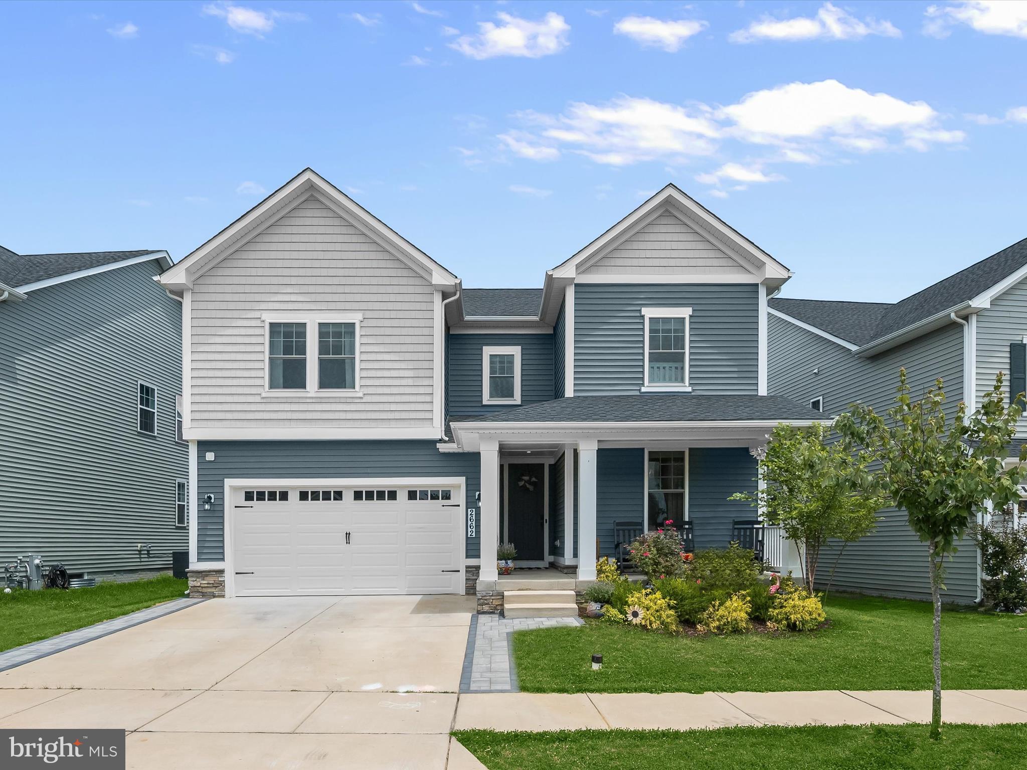 Don’t miss the opportunity to own the only Coronado model in the entire Two Rivers Community featuring a two-story foyer and many custom upgrades! Just off the entry, you'll find a versatile office or bonus room with sunny windows, LVP flooring, and a chic chandelier. The expansive living room features luxury vinyl plank flooring, a gas fireplace with mantel, custom built-in shelving, five bright windows, a modern ceiling fan, and recessed lighting creating a warm and stylish gathering space. The spacious dining room offers a dramatic cathedral ceiling and is surrounded by windows, with a slider leading out to the covered patio. The beautifully appointed kitchen boasts modern pendant lighting, a custom oversized island/breakfast bar with seating for six, bright white soft-close cabinetry, quartz countertops, stainless steel appliances, gas cooktop, herringbone tile backsplash, and a built-in planning station. A butler’s pantry with custom cabinets and shelving adds extra convenience. A powder room completes the main level. Upstairs, the primary suite offers plush carpeting, a modern ceiling fan, bright windows, a soothing neutral color palette, and recessed lighting. The luxurious en suite bath features a double vanity, an extra wide soaking tub, and a modern walk-in shower with tile surround and flooring. A spacious walk-in closet completes the suite. Three additional generously sized bedrooms each include plush carpeting, crown molding, modern lighting, and bright windows. A second full bath features a soaking tub and double vanity. The upper-level laundry room includes a front-loading washer and dryer for added convenience. The finished lower level offers a large family room with plush carpet, a climbing wall, an additional bedroom, two bonus spaces perfect for hobbies or a home gym, and a third full bath.
Upgrades: Fence, Extended Driveway, Butler’s Pantry, Custom Shelving, Window Treatments