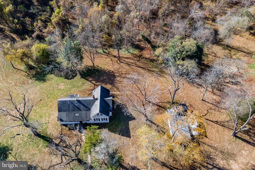 Original 1930's farmhouse located on 83+ acres in Davidsonville!  The home features 4 total bedrooms and 2 full bathrooms, plus wood flooring and a cozy, wood-burning fireplace!  This property is located just minutes from Route 50 and a short drive to Annapolis & Baltimore!
