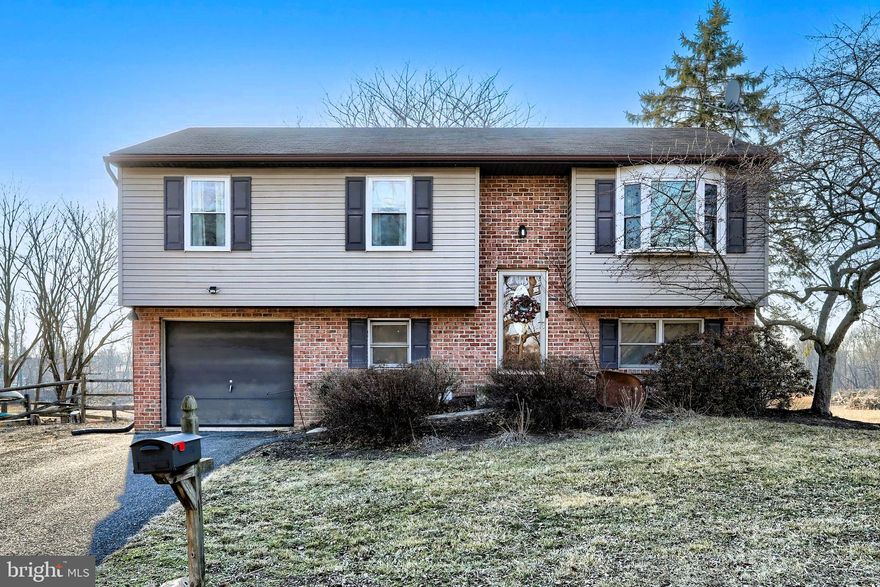 Welcome home to this lovely bi-level situated on a just slightly less than an acre lot. There are endless possibilities outside with this large yard privately backing up to farm land. Entertain on the deck and enjoy the views! Inside boasts a beautiful kitchen and dining area and a cozy living room. The main level has 3 bedrooms and a large full bathroom. The lower level has a large 4th bedroom with recessed lighting and a half bath and laundry room. There's plenty of space inside and outside. Schedule your showing and make it yours!