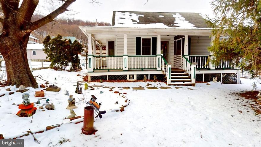 This charming 2-bedroom, 1-bath home, located on a corner lot, offers great potential with the option to convert it back to a 3rd bedroom. The downstairs features nice upgrades and a cozy primary bedroom. Enjoy ample storage throughout the home and plenty of space for entertaining with large front and rear decks, a spacious yard, and a screened-in porch. The detached carport provides convenient access right off the back door. A split rail fence adds to the quaint country living lifestyle while offering privacy and charm. Conveniently located just minutes from downtown allows for everything you need at your fingertips. With a little TLC, this adorable property is ready for its new owners to restore and enjoy!