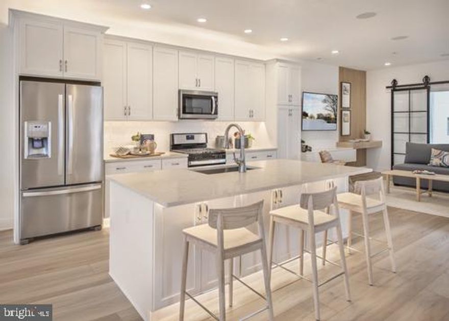 Welcome to Overlook at Town Center, a Toll Brothers community offering new luxury townhomes situated in the King of Prussia Town Center. With a total of 142 townhomes, Overlook at Town Center is the perfect place for low-maintenance living in Upper Merion Township - one of the best school districts in Pennsylvania. The Barry's inviting entry flows up the welcoming stairs to the living level, and views of the spacious great room and desirable covered deck. The well-equipped kitchen overlooks a bright casual dining area and sitting room, and is enhanced by a large center island with breakfast bar, plenty of counter and cabinet space, and roomy pantry. The charming primary bedroom suite is complete with an enormous walk-in closet and spa-like primary bath with dual-sink vanity, large luxe shower with seat, and private water closet. Secondary bedrooms feature ample closets and shared bath with dual-sink vanity. Additional highlights include a thoughtful workspace, convenient powder room, centrally located laundry, and additional storage. Overlook at Town Center is part of The Village at Valley Forge, offering convenient access to upscale shopping and dining experiences within walking distance. The community is also easily accessible to major highways including I-76, I-476, Routes 422, 202, and the PA Turnpike. This is a unique opportunity to own a new construction townhome in a community that offers access to the finest lifestyle enhancements. Pictures are of model home and similar floor plan.