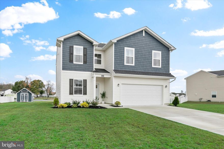 Welcome to this beautifully maintained, like-new home built in 2023, located in the sought-after community of Schooner Landing. Designed for modern coastal living, this home offers a perfect blend of comfort, style, and convenience, all just a short drive to the beaches of Bethany, Fenwick, and Ocean City.

Set on a landscaped homesite with charming curb appeal, this home invites you in through a welcoming foyer that opens to bright, open spaces filled with natural light. A carpeted front room provides a flexible space for an office, playroom, or cozy sitting area, while luxury vinyl plank flooring flows throughout the main living areas, adding warmth and durability.

The heart of the home is the open-concept living room, dining area, and kitchen, an ideal layout for both daily life and entertaining. The kitchen is a showstopper, featuring 42-inch white cabinetry, granite countertops, stainless steel Frigidaire Gallery appliances, a pantry, and a large island that provides extra workspace and seating. Gold cabinet hardware and a gold gooseneck sprayer faucet add a stylish, modern touch. Sliding glass doors lead to a spacious patio overlooking a tranquil pond, creating an easy flow between indoor and outdoor living. A shed in the backyard provides additional storage, and the two-car garage includes a tankless hot water heater and automatic opener for added convenience.

Upstairs, a bright loft offers a perfect spot for reading, lounging, or working from home. The primary suite features peaceful pond views, a generous walk-in closet, and a spa-inspired ensuite with a walk-in shower, bench seating, and dual vanities. Three additional bedrooms share a full hall bath with a tub-shower combination, and the laundry room is conveniently located on the same level for ease of use.

Residents of Schooner Landing enjoy access to community amenities including a sparkling pool and dedicated RV and boat storage, making it easy to embrace the coastal lifestyle. Whether you are looking for a full-time residence or a weekend retreat, this home offers the best of relaxed living with all the modern comforts you desire.