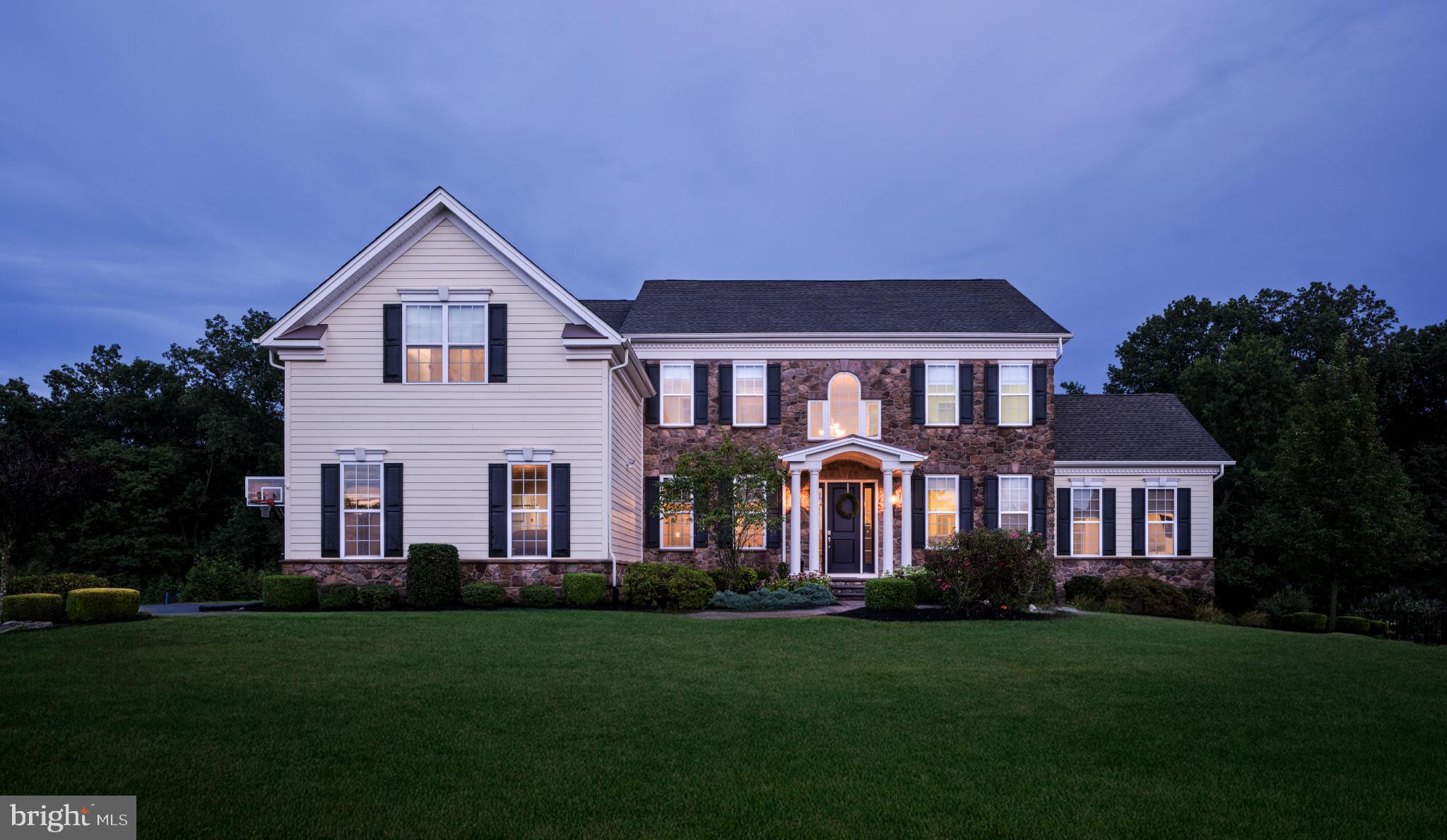 (NO SHOWINGS UNTIL THE OPEN HOUSE ON SUNDAY, AUGUST 17)Nestled in the prestigious Estates at Mill Creek, this exquisite Duncan model custom home sits on a premium lot, offering unparalleled privacy with its wooded backdrop. As you approach, you're greeted by a grand two-story foyer, where an elegant curved staircase sets the tone for the luxurious living spaces that await.
The main floor unfolds with grace and sophistication, boasting 10-foot ceilings with plenty of high hats, double-wide crown molding, and rich walnut hardwood floors throughout. To your left, a formal living room flows seamlessly into a sunken sunroom, bathing the space in natural light. To your right, a gracious dining room stands ready to host memorable gatherings.
The heart of the home is undoubtedly the stunning great room, featuring a coffered ceiling and a cozy gas fireplace. Adjacent to this space, a beautiful home office provides a serene work environment. The kitchen is a culinary masterpiece, boasting a massive center island perfect for casual dining and entertaining. High-end appliances, including a Jenn-Air 6-burner gas cooktop with commercial hood, Jenn-Air refrigerator/freezer, and Kitchen Aid dishwasher, cater to the most discerning chef. A gorgeous stainless steel apron farmhouse sink adds a touch of rustic elegance, beautiful Palladian kitchen cabinetry enhanced by stunning crown molding and an under counter lighting package!
From the kitchen, step out onto a maintenance-free composite deck overlooking the private rear grounds. A convenient mudroom and two powder rooms complete the main level's offerings.
Ascending to the upper floor via either the gracious front or rear staircase, you'll find four generously sized bedrooms and a magnificent bonus room accessed through glass French doors. The Primary Suite is a true retreat, featuring a tray ceiling, beautiful crown molding, and spacious dual walk-in closets. The ensuite bathroom is a spa-like oasis, complete with a frameless shower boasting a rain showerhead, a Kohler soaking tub, dual vanities, a vanity station, and a private water closet.
The additional bedrooms are equally impressive, served by a fabulous hall bathroom. A large laundry room on this level adds convenience to daily life.
The lower level of this home is nothing short of spectacular. Fully finished and accessible via a walkout, it features a Frigidaire wine refrigerator, Kitchen Aid microwave drawer, and sink for effortless entertaining. A fabulous media area and a versatile room that could serve as a sixth bedroom provide additional living space. A full bathroom with a stall shower completes this level.
This remarkable property is further enhanced by a three-car garage and is conveniently located within the highly regarded Central Bucks school district. With its beautiful neutral color palette and meticulous attention to detail, this home in Mill Creek Estates stands as a testament to refined living and timeless elegance.
