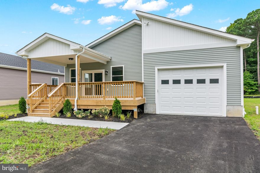 OPEN HOUSE, SATURDAY, NOV 1, 10-12 PM! 100% financing is available! The seller is offering a special incentive with in-house financing that includes up to $10,000 toward closing costs or a rate buy‑down. This brand new home in Rock Hall, a historic harbor town celebrated for its Chesapeake Bay shoreline, boating lifestyle and vibrant coastal charm, features four bedrooms and two bathrooms with two thousand square feet of single level living built with high quality craftsmanship and modern upgrades. It offers gleaming hardwood floors, energy efficient windows, a spacious central island with seating, stainless steel appliances, a large porch for entertaining and an attached one car garage.
Situated on a quarter-acre lot in a new cul-de-sac, the property balances privacy and community. You will be minutes from downtown Rock Hall, where you can enjoy fresh seafood, explore museums and experience the charm of this Eastern Shore town. Whether strolling along the waterfront, enjoying the marina or setting sail on the Bay, you will be at the heart of it all. Experience Eastern Shore living where modern comfort meets small town character and arrange your private showing today.