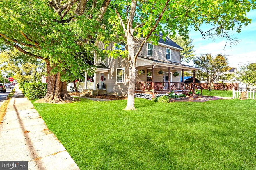 Historic Victorian home with modern updates on a fenced corner lot—5 bedrooms, bonus rooms, deck, and over 2,300 sq ft just blocks from downtown Denton and the Choptank River. Built in 1906, this beautifully updated home offers 2,382 sq ft, 5 bedrooms, and 2.5 baths on a spacious .29-acre corner lot setting with a classic white picket fence and private fenced yard—perfect for outdoor living and entertaining. Thoughtfully modernized while retaining its historic charm, this home blends character with functionality. A welcoming covered deck and expansive rear deck provide ideal spaces for relaxing and hosting. Step inside to discover beautiful flooring that flows throughout, complemented by high ceilings, tall windows that fill the home with an abundance of natural light, and artistic architectural details that add warmth and character. The upgraded kitchen features a breakfast bar, abundant cabinetry, generous counter space, and a recently installed dishwasher—perfect for everyday living and entertaining. The main level is enhanced by 9-ft ceilings and crown molding throughout much of the home. Upstairs, the spacious owner’s suite includes a tray ceiling and upgraded tiled bath. Two additional bedrooms and a full bath complete the second level. The third floor offers two bonus rooms—ideal for guest space, a home office, or hobby use—along with an additional flex space.  Recent updates include newer siding, roof, windows, and updated bathrooms, offering added value and peace of mind. The basement, with exterior access, provides excellent storage, workshop space, or utility area. Located just blocks from downtown Denton, this home is close to shopping, dining, and local amenities. Enjoy nearby Crouse Park with Choptank River access, boat ramp, fishing dock, trailer parking, and walking trails. Outdoor enthusiasts will appreciate nearby Martinak State Park and Tuckahoe State Park for boating, fishing, hiking, and camping. Conveniently located for commuting to Easton, the Bay Bridge, and Delaware Beaches, this property offers the perfect combination of historic charm, modern updates, outdoor space, and prime location. Mortgage savings may be available for buyers of this listing.