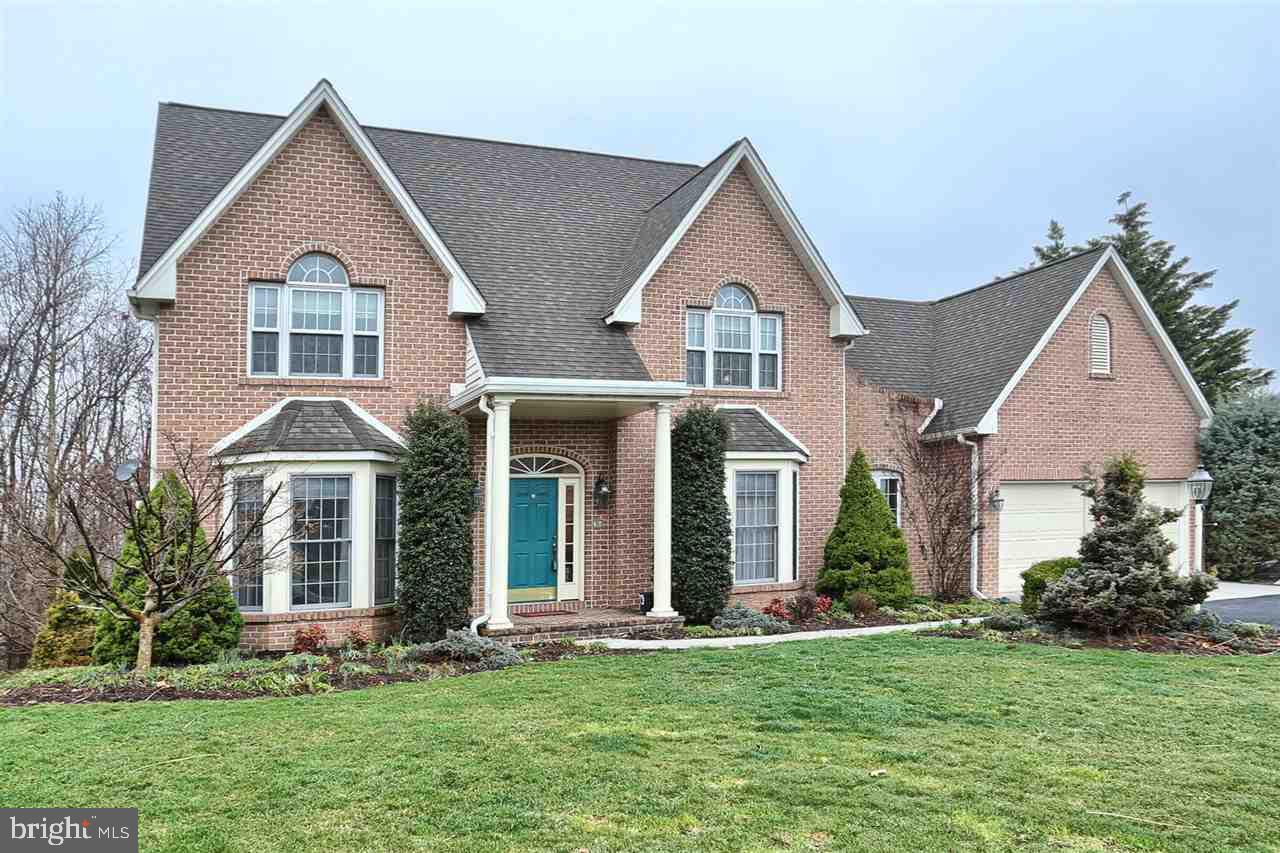 FLORIBUNDA - Elegant four bedroom traditional on wooded lot. Open floor plan features lots of crown molding, fresh paint and maple kitchen with island and granite open to large family room with fireplace. Formal living and dining rooms. MBR suite with bath and whirlpool tub. Deck and walkout basement with patio on private lot. High efficiency heating system.