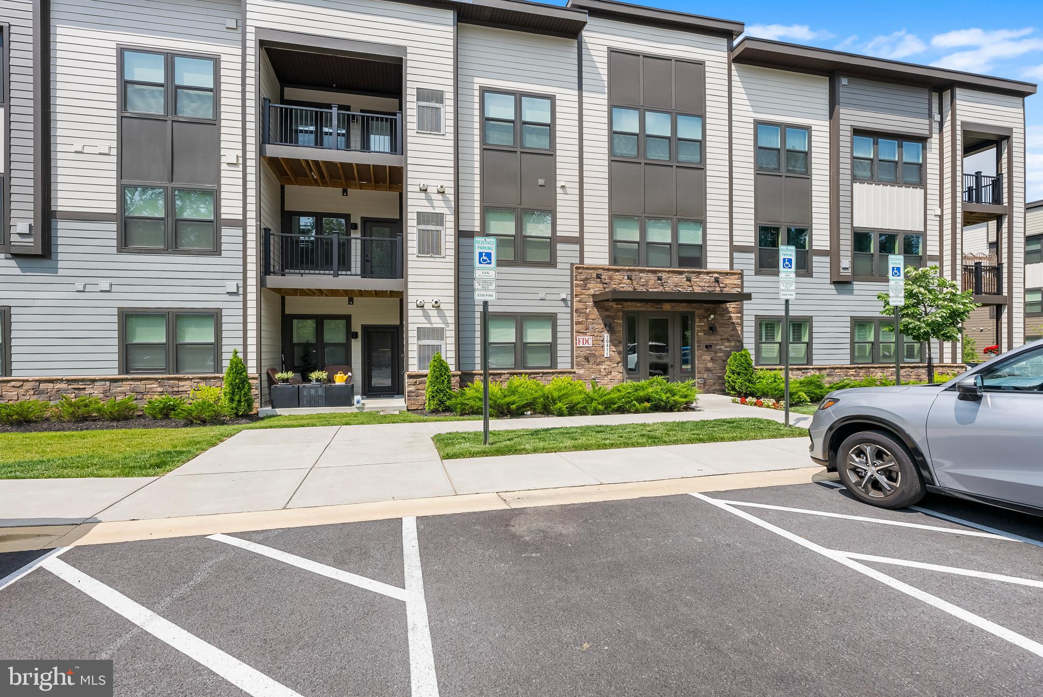 **Buyers had cold feet and decided to wait & this beautiful Condo is back on the Market. Experience comfort of luxury living in this modern 2023-built condominium, offering 1,217 square feet of sophisticated design in the highly desirable Turf Valley community. This gorgeous 2-bedroom, 2-bath condo boasts an open-concept layout with high-end finishes, including remote controlled recessed lighting in living room and elegant luxury vinyl plank flooring that flows seamlessly from the foyer into the expansive, sunlit living & dining area plus gourmet kitchen. Designed for both style and function, the kitchen is a chef’s dream, featuring a large island with pendant lighting & deep sink, soft-close cabinetry, a gas range & premium stainless-steel appliances, a pantry, and a cozy breakfast nook. The oversized bathrooms have been upgraded with beautiful tile flooring, adding to the home’s refined aesthetic. For modern convenience, the condo is fully wired for high-speed gigabit internet, ensuring seamless connectivity for work or entertainment. Additionally, the private walk-out patio features keyless entry, providing both security and ease of access. This home is further enhanced with premium upgrades, including a water purification system for pristine drinking water, an oversized hot water heater that exceeds standard unit requirements, and a touchless smart faucet for added convenience and modern living. Plush carpeting enhances both bedrooms, including the spacious primary suite, which offers an expensive walk-in closet and a spa-like ensuite with dual sinks and a separate shower with a built-in shelf for added convenience. A second full bathroom and in-unit laundry complete the home’s thoughtful layout. Step outside to your private walk-out patio, where you’ll enjoy a serene and picturesque setting. Unlike many units, this rare feature opens to a flat, open space while backing to a lush forest for an unmatched sense of privacy and tranquility. This community is nestled in an unbeatable location of Turf Valley Towne Square shopping & dining, major routes like I-70 and Route 29 plus easy access to DC & Baltimore downtown. Welcome home**