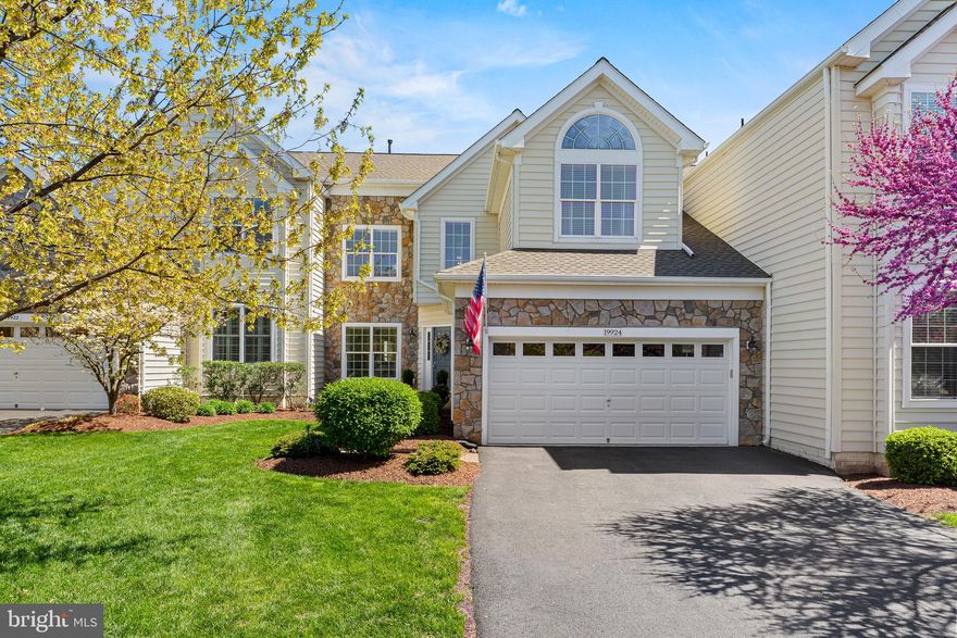 Prepare to be captivated by this exquisitely maintained Victoria model w/ loft carriage home, perfectly positioned overlooking the 8th hole of the Arnold Palmer designed Belmont Country Club! Step inside and discover a haven of refined living, boasting three generous bedrooms, a private 3rd-floor loft retreat, an elegant 2-story living room, and two and a half beautifully appointed baths. Recent major renovations in 2019 introduced stunning refinished hardwood flooring throughout the first floor, setting the stage for the gourmet kitchen of your dreams. Imagine culinary creations unfolding amidst all-new soft-close cabinetry (including additional 14" uppers!), crown molding, under-cabinet lighting, a substantial 96" quartzite island with under-counter storage, and top-of-the-line stainless steel appliances featuring a 5-burner gas cooktop, double wall oven, microwave, and chic gold-tone hardware and chandeliers. Beyond the kitchen, discover a completely remodeled laundry room offering both style and functionality with cabinetry, a front-load washer/dryer, granite countertops, LVP flooring, and a convenient laundry sink. The first-floor powder room has also been tastefully updated with a new vanity, sink, and granite countertop. Enjoy seamless indoor-outdoor living with a new all-weather deck railing installed in 2021, perfect for enjoying the serene views. Retreat to the completely remodeled primary bath, featuring a frameless shower, an expansive enlarged quartz double vanity sink, soft-close cabinets, quartz countertops, and elegant 12" x 24" ceramic tile flooring and shower area. Peace of mind is ensured with a new sump pump (2022), and essential systems have been updated with a new furnace, water heater, and A/C unit in 2023/2024. The second-floor hall bath received a stunning makeover in 2024 with a new quartz double sink vanity, soft-close cabinetry, and stylish 12" x 24" ceramic tile flooring. A new roof adds the final touch of worry-free living. Outside, discover your own private sanctuary with a stone waterfall, large deck, and patio, all enveloped by mature bushes and trees for ultimate privacy. The full basement awaits your personal touch, offering endless possibilities for customization. This is more than a home; it's a lifestyle, a perfect blend of elegance and opportunity in a coveted location.