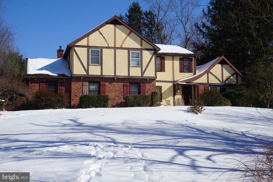 Calling on all DYI homebuyers, contractors, and builders.  Great opportunity to restore and own this awesome Tudor home perched high on a hill with  long driveway and your own bridge spanning a stream.  This property has 4 bedrooms, 2 1/2 baths with a Living room, Dining room, Eat-in Kitchen with center Isle and Granite counter tops, Family room w/fireplace, 1st floor office, and bonus finished space in place of the two car garage.  The property also has an inground pool, partial basement, all on a 1.6 acres in a neighborhood with homes of much higher value.