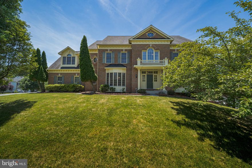 OPEN HOUSE CANCELLED GOING UNDER CONTRACT! New price! Nestled in one of the premier neighborhoods, this elegant and sunny brick-front home offers 8,000+ sqft of finished living space on a 0.42-acre corner lot, complete with a 3-car garage. A grand 2-story foyer with Palladian windows welcomes you inside, where freshly painted interiors, crown molding, chair railing, bay windows, skylights, and gleaming wood floors await. The dual access stairs lead to multiple versatile rooms. A 2-story great room with a wood-burning fireplace and a wall of windows connects seamlessly to the eat-in gourmet kitchen, featuring new ceramic tiles, a gas cooktop island, new stainless steel appliances, a bar, and ample counter and cabinet space. Upstairs, spacious bedrooms each boast their own full bath and walk-in closet. The primary suite includes a sitting room, 2 walk-in closets and a spa-like bath. The attic level offers a bonus bedroom, full bath, and office/game room. The finished walkout basement adds over 2,300 sqft of finished space with new laminate flooring, two bedrooms/dens with a full bath, a recreation area with a gas fireplace, a kitchenette, and patio access. Additional highlights include 2-zone HVAC and a large driveway accommodating 8+ vehicles. Water heater 2018. Basement furnace 2022. Conveniently located off Georgia Ave, near ICC 200, and within 1.5 miles of Olney Rec Park, Leisure World Plaza, Roots Market, Manor Country Club, and a park-and-ride lot. It's a 10-minute drive to Rockville and Glenmont metro stops. All sqft is estimated