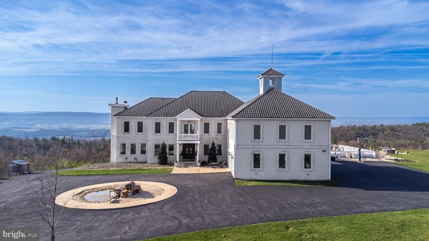 Luxury Mountain Estate with Unmatched Amenities Near Penn State: A stunning 5-bed, 6.5-bath mountain-top estate on 35 secluded acres, offering over 7,800 sq ft of finished interior space. Built with ICF construction, featuring geothermal heating and a backup generator, it provides an efficient, durable, and off-grid capable lifestyle. Enjoy a chef’s kitchen, walk-in closets, spa tubs, a large pool, a barn, oversized garage spaces, and more. Experience mountain living just minutes from Penn State University. Schedule your private tour today.

Additional Amenities

- 20x40’ pool & spacious deck
- 60x40’ barn
- Oversized 4-car garage with RV bay + basement garage
- 400-amp electric supply
- Lifetime stone-coated Spanish-style metal roof
- 600’ well with 1,000-gallon basement water holding tank with softener
- 1,000-gallon buried rain collection system
- Full off-grid capability with dual manifolds and hot water tanks
- 1,000-gallon buried propane tank
- Dual laundry facilities

**Showings require verified proof of funds or a pre-approval letter.**