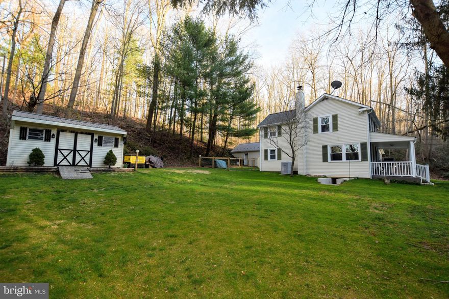 Come find your piece of heaven in Jarrettsville only a HALF MILE from Rocks State Park! Sitting on 1.64 acres of cleared and wooded land, this gorgeous house and property have been pristinely maintained. Whether enjoying the peace and quiet from either of the two covered porches or enjoying the world-renowned trails, vistas, and waterways of the State Park, this property has SO MUCH to OFFER! New architectural roof in 2017, oversized AC unit and Carrier Furnace in 2010/11.  Wood stove in the basement  keeps bills low-- Highly efficient home led owners to use only 150 gal of fuel last year! Outside features an incredible cleared lot plus plenty of wooded area too. Above the house there is a 2nd septic, water and electric hook up for your RV/Trailer! An incredible perk rarely found! Besides the one car garage w/ workbench area and whole house generator, there are two other sheds-- enough storage for all of your needs. Come visit today before it is sold! This immaculately maintained home is being sold in as-is condition.