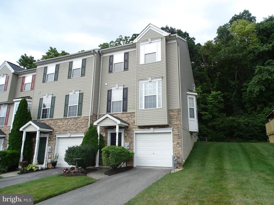 Remarkable One Owner End Unit Town Home in Central School District 2 minutes from Exit 24 of I-83!!!  Walking into this home, it like walking into a brand new town home.  This gently used home features: Finished One Car garage with opener, Foyer with coat closet, Unfinished basement with Laundry area. First floor with 9 foot ceilings, Large Living Room, 1/2 Bath, Eat in Kitchen with Oak Raised Panel Cabinets, Island, Ceramic Tile Floor, Recessed Lights, Pantry closet, and All appliances.   Off the kitchen their is a 10X11 Family room with a gas log Fire Place and wood mantel.  This room also has sliding door access to a future deck.   On the second floor you will be greeted by a large Master suite with Cathedral ceilings, Walk in closet, and a Master Bath with double vanity, Soaking Tub, and Separate shower.  There are two additional bedrooms and a hall bath that have never really been used.  Located across the street from additional over flow parking, so that your guests will not have to hunt for a parking space.   This gently used end unit town house is a true find in today's market.