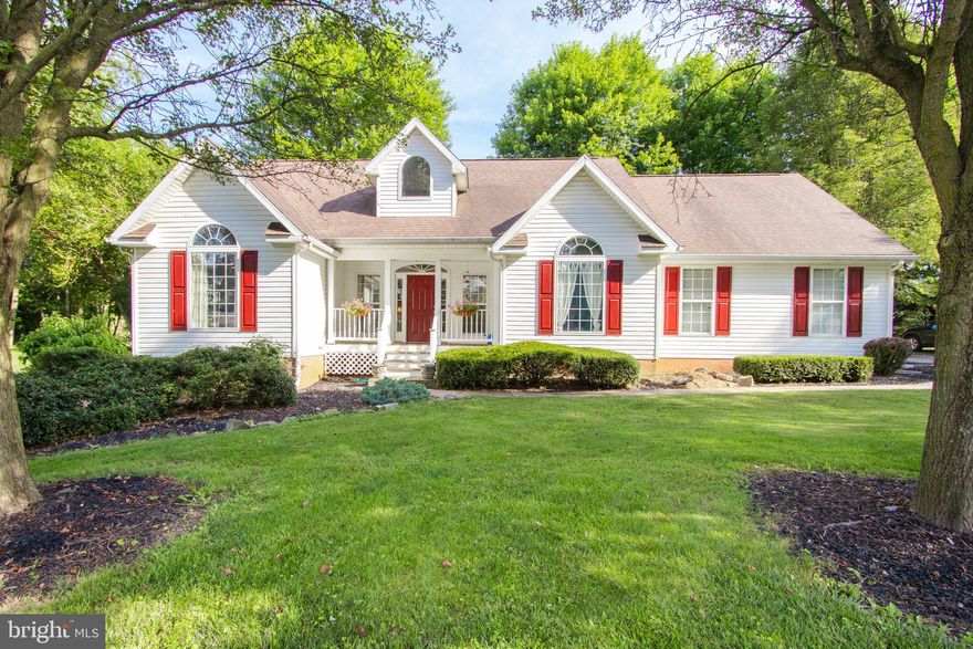 MORE PICTURES TO COME TODAY.  
The old adage that a house won't last long is really true here! This one won't! From the minute that you walk in the front door...incredible foyer light fixture conveys...you are welcomed  into the great room and kitchen areas. Warm wood floors throughout with two bedrooms on one side and the master suite on the other so nice separation and privacy.  Kitchen has beautiful custom cabinets and stainless appliances. Both the great room and kitchen lead to an extra large (260 sq. ft.) deck for entertaining. The master bedroom has access as well! BUT, the icing on the cake is the SEPARATE DETACHED TWO CAR GARAGE THAT OFFERS A VERY NICELY FINISHED STUDIO/OFFICE/IN-LAW/APT. SPACE POTENTIAL WITH HIGH CEILINGS, KITCHENETTE, BEDROOM AND BATH!  PLEASE NOTE: THIS ADDS ANOTHER 400 Sq. Ft. of LIVING SPACE! Beautiful landscaped lot and paved driveway in this small community tops everything off. Only  10 minutes to Shepherdstown and Martinsburg...centrally located for commuter routes too!