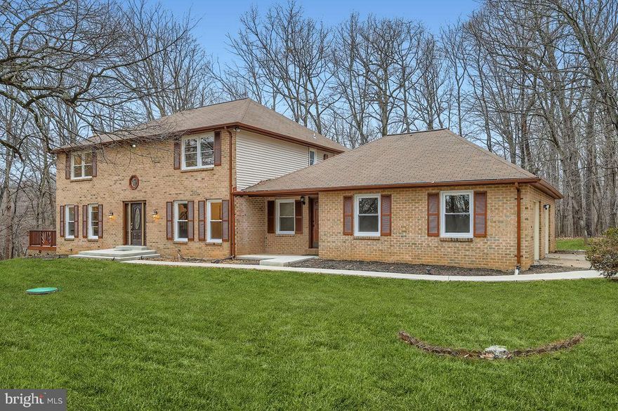 Due to inclement weather open house is cancelled. Better than new! This beautifully updated home in the desirable Valley Hills neighborhood offers over 5,000 sq. ft. of living space and features a modern, open-concept design throughout.
A grand two-story foyer welcomes you with elegant crown molding and a stunning staircase leading to the upper level. The new gourmet kitchen boasts 42" cabinets, a large center island, quartz countertops, and sleek black stainless steel appliances. The expansive family room includes a fireplace and two sliding doors opening to the deck, while the separate living room, also with its own fireplace, offers an additional set of sliders to the deck—perfect for indoor–outdoor living.
The main floor features a highly convenient bedroom with a full bath, ideal for a mother-in-law suite, guest suite, or private flat, as it can be easily separated from the main living area.
Upstairs, the primary bedroom suite includes an updated bathroom, fireplace, and walk-in closet. Three additional spacious bedrooms and a full hall bath complete the upper level.
The fully finished basement provides an enormous recreation room, another full bath, and two additional rooms that can serve as bedrooms, offices, hobby spaces, or more.
Situated on a beautiful corner lot in a quiet, established neighborhood, this home combines modern upgrades with classic comfort—truly move-in ready.