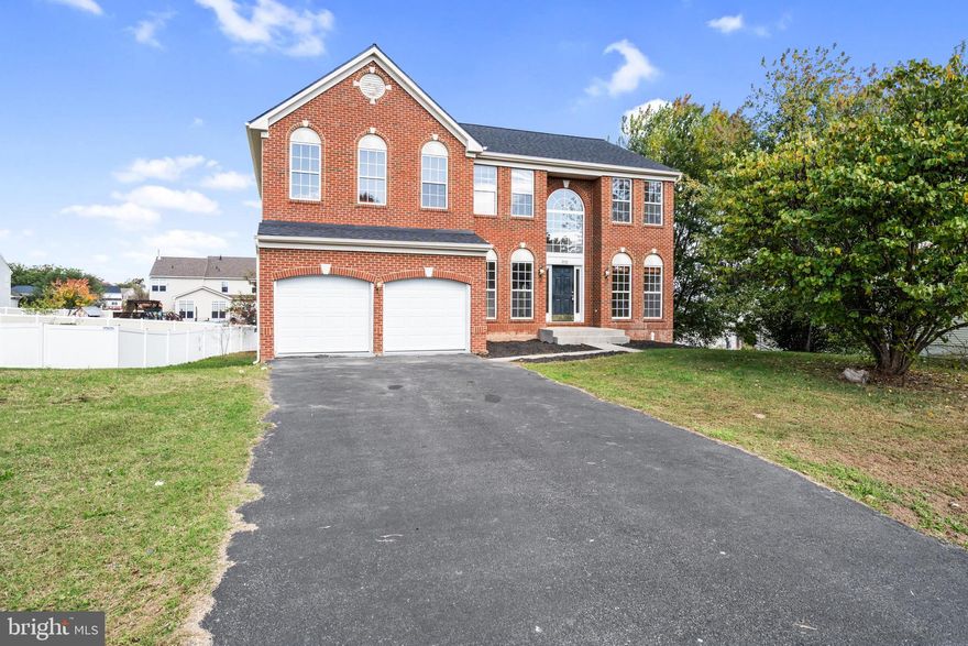 Remarkable home with room for two families. Home features new flooring and paint throughout the entire house. Basement comes equipped with its own living space and by itself could house a family with its own 2nd kitchen , two bedrooms, a living room and a full bathroom with its own entrance. The main level has beautiful wide plank floors with a nice open layout for your family room with fireplace and great kitchen with Some new appliances and granite countertops. Main level also features an office, and a formal living room and dining room and powder room.  Upstairs you will find 4 large bedrooms and two full baths. The master is enormous and comes with an additional sitting room, walk in closet and tiled master bath. Home also features a newer roof as well as many other updates.....must see to appreciate.