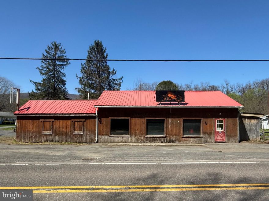 GREAT EXPLOSURE FOR FUTURE BUSINESS FRONTING ON NEW CREEK HIGHWAY-RT 93.  ROUGH-CUT LUMBER EXTERIOR, METAL ROOF, PARKING FOR 14 CARS, REAR FENCED YARD AND SITUATED ON .224 ACRES OF LAND. INTERIOR OFFERS LARGE BAR ROOM/SHOWROOM WITH LAMINATED H-WOOD FLOOR, DRYWALL & ROUGH-CUT LUMBER.  KITCHEN AREA WITH S/S LINED WALL BACKING, METAL CARTS, S/S HOOD & CONCRETE FLOOR. WASH ROOM W/TRIPLE S/S SINKS, WALL CABINETS.   ½ BATH AND CUSTOMER BATHROOM W/LINOLEUM FLOORS.  LARGE STORAGE ROOM.  CALL FOR VIEWING.