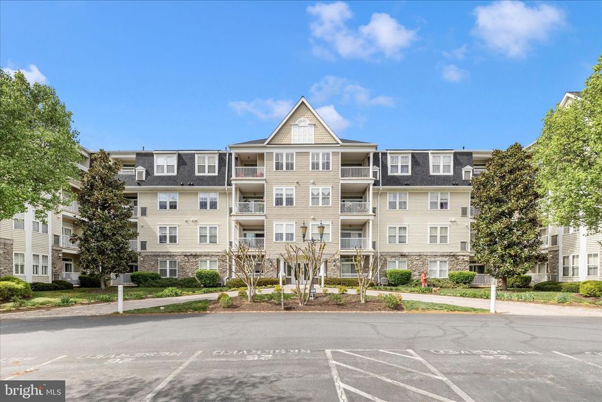Discover an exquisite lifestyle in the heart of Wormans Mill boasting a strong financial Condo Association.   Luxury meets comfort in this stunning 2-bedroom, 2.5-bathroom first floor unit. Spanning 1,362 square feet, this residence is designed with an open floor plan. Step inside to find a beautifully appointed kitchen, featuring a breakfast area perfect for casual dining and entertaining. Equipped with high-end stainless steel appliances, including a gas oven/range, dishwasher, microwave, and refrigerator. The kitchen's table space is ideal for intimate meals, while the adjoining dining area sets the stage for more formal gatherings. This unit's unique position to the daily sun movement creates natural light which floods the living spaces through bay and bow windows. The spacious living room, complete with a cozy fireplace, serves as the perfect backdrop for relaxation or entertaining guests. Retreat to the primary suite, a sanctuary of tranquility featuring an en-suite bath designed for indulgence.  This unit also has convenient features such as an entry-level bedroom, window treatments, and a dedicated laundry area with washer and dryer. Security is paramount, with a fire detection system, smoke detectors, and a main entrance lock ensuring peace of mind. Step outside to enjoy your own private patio or porch, perfect for morning coffee or evening relaxation. The community amenities elevate your lifestyle further, offering access to outdoor pools, tennis courts and a clubhouse. Explore the scenic bike trails or unwind at the putting green-there's something for everyone.  This is more than a residence; it's a place to create lasting memories.