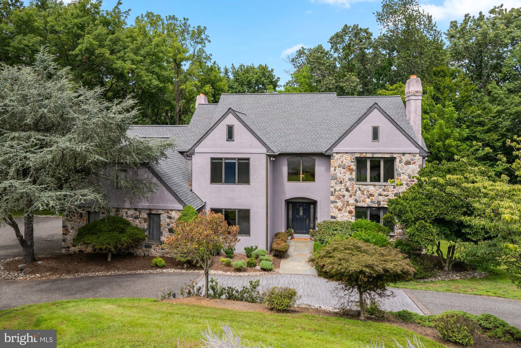 Only a job relocation can tear the sellers away from this dream home at 412 Hidden Valley Rd. This custom-built beauty with a contemporary flair was designed to integrate indoor and outdoor spaces with gorgeous views including the Crum Creek Reservoir. Located at the end of a quiet cul-de-sac in the award-winning Wallingford-Swarthmore School District, this home is close to the vibrant town of Media with easy access to 476, 95 and Philadelphia Airport, as well as and trains to Center City. 412 Hidden Valley is set on a landscaped 1.1 acre lot with a convenient circular drive. As you enter from the flagstone walkway, you are welcomed into the airy two-story foyer with refinished hardwood floors and new light fixtures. The entry foyer is flanked by a large office with triple windows and built-in bookcases to the left and a formal living room with marble -surround, wood-burning fireplace to the right. From there, flow into a large dining room which opens onto an expansive deck. Continue into the spacious kitchen where you’ll find custom cabinetry and appliances like a built-in Subzero refrigerator, Jenn Air cooktop and a center island with bar sink and seating. There is a large breakfast room area with oversize windows to take in the view. The kitchen is open to the family room with a two-story ceiling, an abundance of natural light and floor-to-ceiling stone gas fireplace.. A sliding door leads onto an enclosed screened porch complete with lighting and ceiling fan which also opens onto the deck. This great room with easy access to the outdoors and beautiful woodland views is an exceptional gathering spot on spring and summer days. A powder room, a large laundry room and an attached 3 car garage complete this floor. The second level features four generously-sized bedrooms and three full bathrooms. The primary suite boasts beautiful views from all of its windows and has a built-in desk, a large bathroom with double-size whirlpool tub, dual vanity and steam shower. The walk-in closet was recently outfitted with a custom closet system. There are two spacious bedrooms that share a hall bath with tub/shower combo and at the far end of the hall, there is an en-suite guest bedroom with full bath. The lower level is another entertainment space that is spacious enough for multiple recreational uses, including work-out space, entertainment center, or music room. The walkout basement has access through sliding doors to the backyard, and many windows allow natural light into the space.. This lovely home includes a 20KW Generac Generator and was recently painted, with new carpeting, lighting and refinished hardwood floors. Move right in!
