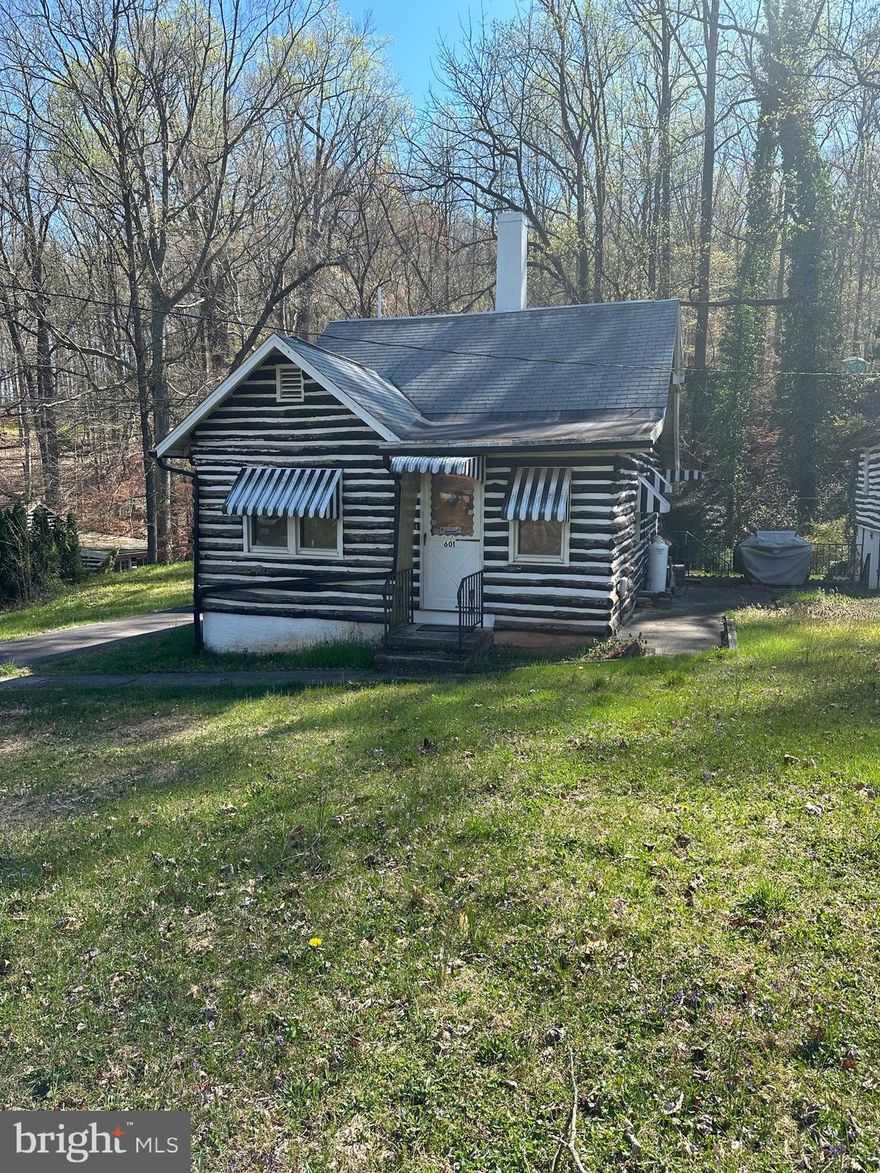 Welcome to your tranquil retreat! While in need of some TLC, this charming 3-bedroom, 1-bath home is nestled in a serene setting with breathtaking views. Step outside to discover a peaceful stream meandering through the backyard, complete with a soothing waterfall that adds to the natural ambiance.

In addition to the main house, this property boasts a second structure, offering endless possibilities. With a little TLC, this space could be transformed into a guest cottage, studio, or whatever your imagination desires. Embrace the opportunity to create your own oasis in this picturesque location.

Don't miss out on the chance to make this your dream home, where everyday life feels like a vacation.

Owner will include in purchase push lawn mower, lawn tractor, snowblower, and all yard tools currently in the shed.