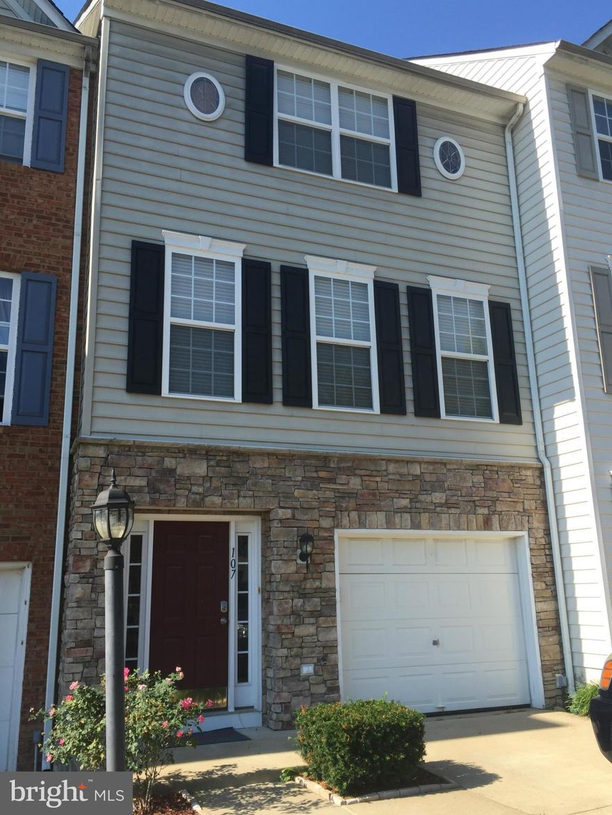 This home is a cozy and spacious 3 level townhouse.  2 Large master suites with bathrooms on the upper level, large open family room with multisided gas fireplace, formal dining room, kitchen with upgraded GE appliances and built in desk,  entry level with media room & full bath.  Large deck and 1 car garage.  Only minutes to Quantico.  Pets on a case by case basis.