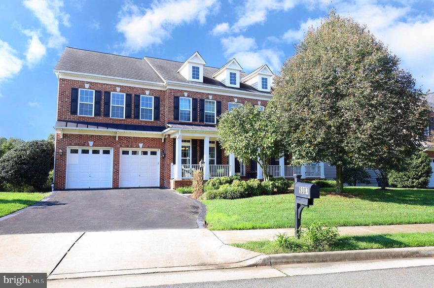 Welcome to the epitome of luxury living in this stunning 6-bedroom, 4.5-bathroom home spanning 4,300 square feet. Nestled in the prestigious Belmead at South Run Crossing,  this residence is a masterpiece of design and craftsmanship.
The charm of the covered wrap around, brick front porch sets the tone for the elegance within. Inside, you will be greeted by the warmth of distressed hickory hardwood floors and sweeping 2-story foyer. The main level is a showcase of sophistication, featuring crown molding throughout, a spacious living room, formal dining room with half-wall wainscoting, and a private study. The gourmet kitchen is a chef's delight, boasting new stainless-steel appliances, granite countertops, a kitchen island, gas cooktop, water dispenser, and a convenient butler's pantry with a sink connecting the kitchen and dining room. 
The heart of the home lies in the family room, adorned with distressed hickory hardwood floors, a coffered ceiling, and a cozy gas fireplace. The open floor plan seamlessly connects the kitchen, breakfast nook, and family room, providing the perfect space for entertaining and everyday living.
Ascend the stairs with wrought iron balusters to discover the upper level, where the primary suite awaits. This retreat features a coffered ceiling, sitting room, dual walk-in closets, and an ensuite bath with cherry cabinetry, double sinks, a soaking tub, and a shower. Four additional bedrooms offer ample space, each equipped with closet organizers. Two full bathrooms with marble countertops, one with a private bath, cater to the needs of the upper level. The convenience of an upper-level laundry room with front-loading machines adds a practical touch.
The lower level is an entertainer's dream, boasting a recreation room with built-in speakers, ideal for a theater room. An additional bedroom and full bathroom provide flexibility, while two unfinished storage rooms offer ample space for your belongings.
The exterior of the home is equally impressive, featuring a trex deck with a retractable awning, a brick patio, raised garden beds and a serene backyard overlooking trees and a community pond. A sprinkler system ensures a lush and well-maintained landscape. With fresh paint and new carpet throughout, a new 70-gallon water heater in 2022 and two HVAC systems for zoned heating and cooling (2022 and 2021), this home is not only luxurious but also equipped with modern comforts.
Conveniently located near the South Run Recreation Center, Giant shopping center, and major commuter routes, this residence offers the perfect blend of elegance and convenience. Don't miss the opportunity to call this exceptional property home!