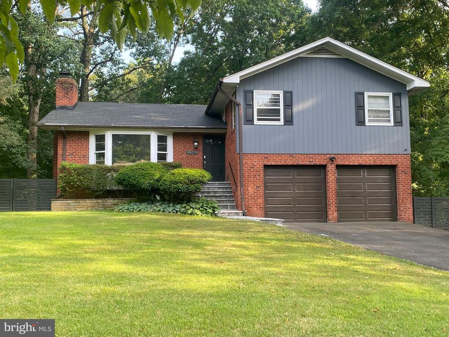 Welcome to your dream home nestled in a serene park-like setting! This wonderful property offers a picturesque backdrop with lush trees, a peaceful stream, and beautiful views of Ashby Pond in the winter. Enjoy the best of outdoor living with a spacious screened/plexiglass porch that leads to a charming patio, perfect for grilling and relaxing in the hot tub.

Inside, you'll find gleaming wood floors throughout the main and bedroom levels, creating a warm and inviting atmosphere. The kitchen is a delight with windows overlooking the backyard and featuring white cabinets, granite countertops, and stainless steel appliances, and it seamlessly opens to the dining room for easy entertaining.  Baths have significant updates too. Roof new 2023 and exterior trim painted '24.

With no HOA to worry about, you'll have the freedom to make this home truly your own. The property also boasts a new roof and front stoop, ensuring peace of mind for years to come. The two-car garage provides ample parking and storage space.   Be sure to notice the extra storage area under porch.

Location is key, and this home has it all. A free Cue bus stop at the front of the neighborhood offers convenient access to George Mason University, Vienna Metro, and an array of shops. For outdoor enthusiasts, bike and walking paths are just a stone's throw away.

Don't miss the opportunity to own this exceptional home in a highly desirable area. Schedule your visit today and experience the perfect blend of nature and convenience!