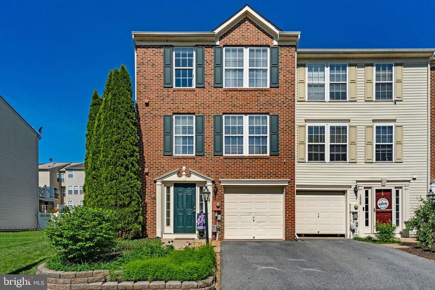 Welcome to this stunning brick-front end unit townhome offering over 2,300 finished square feet of thoughtfully designed living space, filled with natural light throughout and enhanced by desirable architectural bump-outs on every level.

The fully finished lower level features newer LVP flooring, a tiled foyer entry, and a convenient half bath. This flexible space is ideal for a recreation room, home office, guest area, or additional living space to suit a variety of needs.

The main level showcases hardwood flooring throughout and an open, inviting layout designed for both everyday living and entertaining. The kitchen serves as the focal point of the home, featuring a center island, stainless steel appliances, tile backsplash, recessed lighting, and a bright bay window that brings in an abundance of natural light. The oversized kitchen footprint provides ample space for dining, offering flexibility for how the adjacent area is used.

The adjoining dining/flex space offers versatility and can function as a formal dining area, secondary living space, home office, or playroom. From here, step out to a 10x20 Trex deck—perfect for low-maintenance outdoor living, dining, and relaxation.

Upstairs, the spacious primary suite features plush carpeting, a ceiling fan, a generous walk-in closet, and an en-suite bath complete with a soaking tub and excellent natural light. The additional bedrooms are well-proportioned and continue the home’s bright and comfortable feel.

Located in a highly desirable commuter-friendly neighborhood, the community offers sidewalks for easy walks and a tot lot/playground, adding to its overall convenience and livability.

This home combines space, functionality, and natural light in a way that is both practical and inviting—offering a layout that adapts easily to a variety of lifestyles.