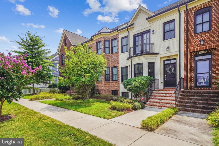 OPEN SUNDAY, 11/23, 12-2pm.  Ask me about the VA Assumable Loan! This beautiful white brick-front townhome by Main Street Homes is move-in ready and ideally located in the heart of Urbana.  Built in 2013, this 4-bedroom, 3-bathroom home offers 2,654 square feet of well-designed living space spread across three levels. Enter at the main level featuring hardwood floors throughout the formal living, kitchen, dining, and family rooms. Enjoy an updated kitchen with granite countertops, stainless steel smart appliances, a pantry and a breakfast bar with access to a private rear patio, perfect for entertaining. A detached rear-entry 2-car garage and 2-car driveway offer plenty of parking, in addition to the rear cul-de-sac. The garage has a TESLA EV charger. Upstairs, the spacious primary suite boasts a tray ceiling, custom walk-in closet, and spa-like bath with soaking tub and separate shower. Two additional spacious bedrooms, a full bath, and a laundry room complete the upper level. The finished lower level includes a 4th bedroom, full bath, large rec room, and extra storage. Close to top-rated schools, parks, tot lots, trails, shopping, dining, commuter routes and so much more!  Parking is easily found on Brien Pl and behind the home on Brien Aly!