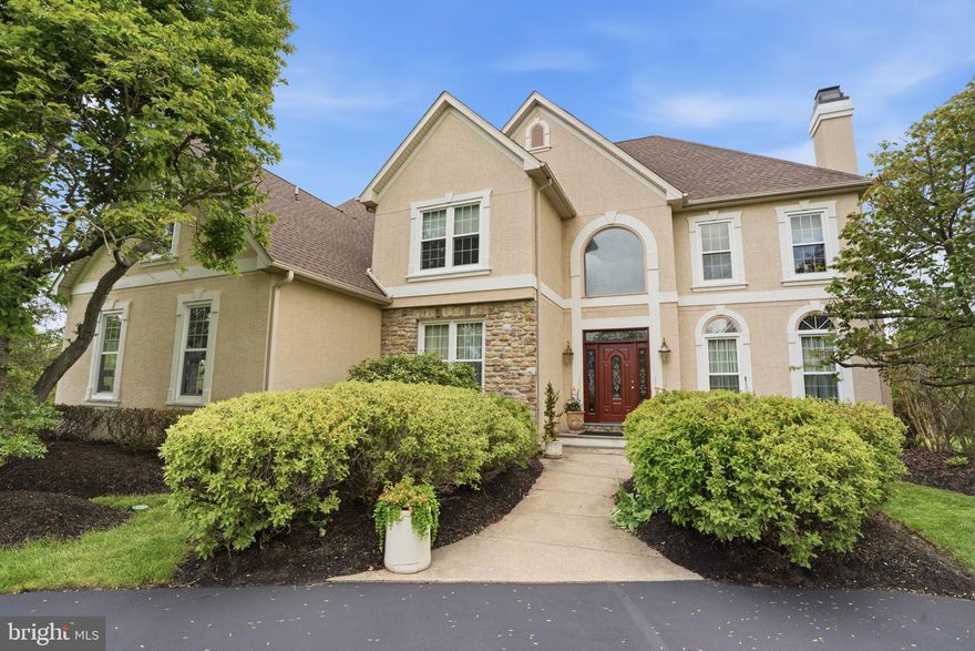 Set on a pristine 1-acre lot in the premier Deerfield community, this elegant colonial offers over 4,100 square feet of refined living in a quiet, upscale neighborhood known for its privacy and convenience. A circular driveway and side-entry three-car garage create a striking first impression, while the inviting front entrance with leaded glass door and transom opens to a dramatic two-story foyer, highlighted by a palladium window, hardwood floors, and a graceful staircase.
Designed for both everyday living and memorable entertaining, the home features formal living with marble fireplace and dining rooms adorned with hardwood flooring and detailed moldings including crown, chair rail, and wainscoting. The heart of the home is the gourmet kitchen, complete with a center island, stainless steel appliances, tiled backsplash, double pantry, and a sunlit breakfast area.
Just beyond, a step-down two-story family room impresses with a floor-to-ceiling stone fireplace and a convenient back staircase, flowing seamlessly into an oversized sunroom filled with natural light, soaring ceilings, and atrium-style leaded glass doors. A private first-floor office or library with built-in shelving, along with a laundry room and powder room, adds everyday functionality.
Upstairs, the luxurious primary suite offers a tray ceiling, a comfortable sitting area, and a spa-inspired bath with a jetted tub. Three additional spacious bedrooms and well-appointed baths complete the upper level. The partially finished lower level provides flexible recreation space while still offering abundant storage.
Outdoors, mature plantings and elegant landscaping surround a freshly painted custom deck—perfect for relaxing or entertaining in a serene setting. Ideally located near shopping, dining, historic downtown attractions, and major commuter routes, and served by the highly regarded Council Rock School District, this home seamlessly blends timeless design, modern comfort, and an exceptional location.