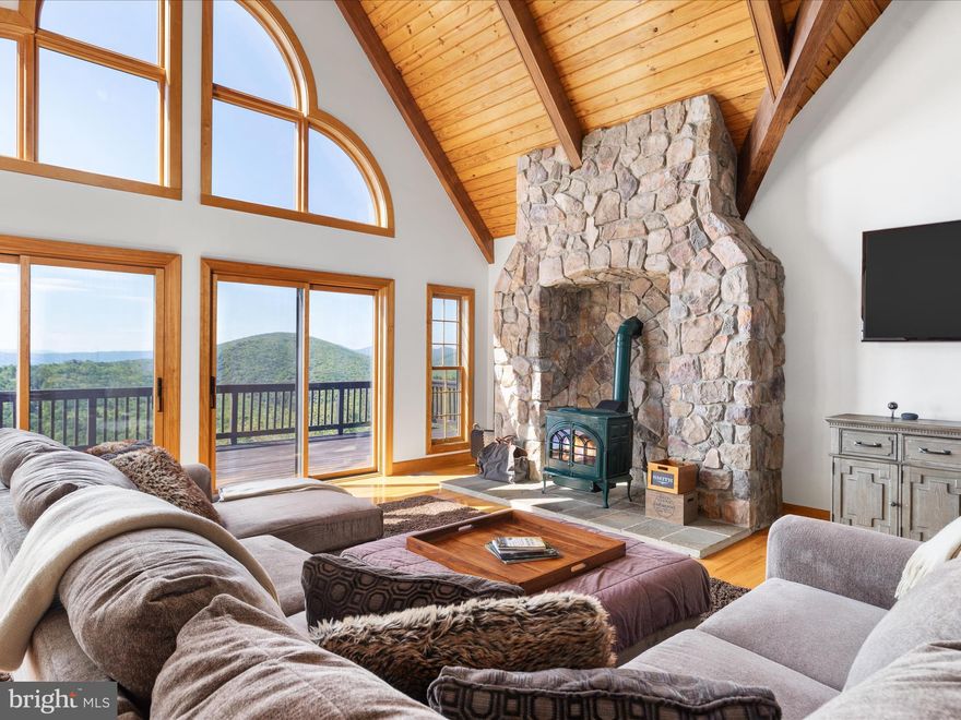 Nestled atop the Great North Mountain, this mountaintop retreat offers unparalleled, breathtaking panoramic views. Truly a rare combination of privacy, seclusion, and stunning natural beauty perfect for those seeking a true connection with nature. Situated just west of Stephens City, it is bordered by Short Mountain to the south and Eagle Rock to the north, providing unmatched views of the surrounding mountains and valleys. This fully wooded estate extends to the summit of North Mountain, offering end-of-the-road privacy, private access to the Tuscarora Trail, and endless opportunities for hiking, horseback riding, camping, and outdoor recreation. The property trails are fully accessible and run along the entire length, allowing for uninterrupted exploration and hunting. 

The spacious lodge boasts nearly 2,500 square feet of living space, including three bedrooms, three full bathrooms, and an unfinished walk-out basement that is fully plumbed for a 4th bathroom. At the heart of the home, the great room features cathedral ceilings, a woodstove, and a loft overlooking the space below. The expansive kitchen, complete with an island, opens to a sunroom equipped with a wood burning fireplace, perfect for entertaining or enjoying quiet mornings in nature. The property also includes a 20 ft x 40 ft pole barn, providing ample storage for gear and equipment. 

Residents of this gated community enjoy secure access via Great Mountain Lane, requiring a 4-wheel or all-wheel drive vehicle to reach the property. The western boundary of the estate is marked by the Virginia-West Virginia state line, and the land is rich with wildlife, including deer, turkey, and bear. A small mountain stream flows through the property, adding charm to the landscape. Short-term rentals are allowed, presenting an excellent investment opportunity. Additionally, the property can be subdivided into 20-acre lots, offering future development potential. Furniture and household items are conveyed with the sale of this property. 

Zoned RA and enrolled in the county’s Forestry Land Use program, this property is ideal for those seeking both a private retreat and a sustainable investment. Despite its secluded location, it is only a short drive from Winchester's amenities and attractions, as well as the nearby Capon Springs Resort. Equipped with Starlink Internet, the property combines the best of remote living with modern convenience. This is not just a home—it's an escape from the hustle and bustle of everyday life. Whether you’re looking for a weekend retreat, a full-time residence, or a place to reconnect with nature, this mountaintop property offers the perfect blend of seclusion and modern comforts.

*An extensive list of personal property is also available for purchase; contact the agents for details