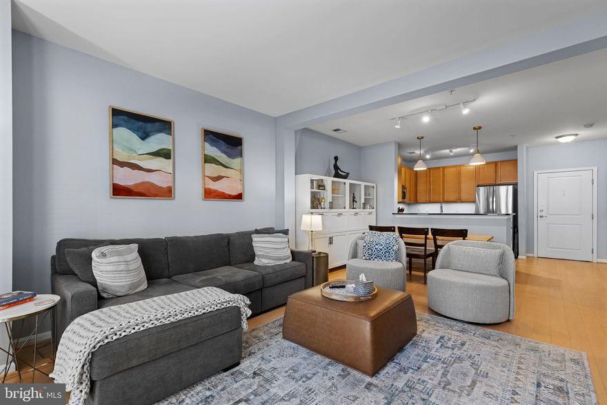 Bright ONE bedroom, one bath unit WITH DEN within walking distance of Metro, shopping, and dining! This SPACIOUS, open floor plan unit  gives you tons of storage, including a WALK-IN CLOSET and a kitchen with ample counter space and cabinetry, a breakfast bar that easily seats four people, and room for a full dining table for more formal gatherings. Large living room opens to one of two Juliet balconies in the unit. Sizeable primary bedroom opens to the second balcony. Recent UPDATES include pendant lights over kitchen sink, undercabinet lighting, new lighting in bathroom, modern paint for bathroom vanity, ceiling fan installation in primary bedroom, and built-in storage in dining room! Laundry is in-unit and includes a full size washer and dryer. The incredible Halstead amenities include concierge service, 24/7 security, outdoor pool, indoor basketball court, party room with pool table and dart board, courtyard, and fitness center. Condo fee also covers one assigned garage parking spot, water, sewer, and trash. When you do need to leave this amazing community, your options are limitless, being located steps away from Dunn Loring Metro. Need a little structure to your exercise routine? Orange Theory Fitness is at your doorstep. Shopping for you or your guests? Harris Teeter is across the street. Want to eat out? Try tons of local and national favorites, such as District Taco, The Casual Pint, Inca Social, and Starbucks. If that isn't enough, Mosaic District options are less than a mile away. This pet-friendly building is also across the street from a dog park. This home gives plenty of flexibility to those looking for two bedrooms at a more affordable price, or for anyone who wants a home office. Make convenience, amenities,  and space yours.