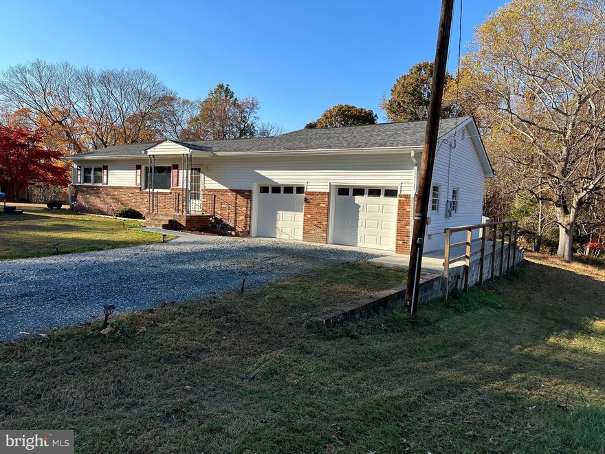 Make sure you click on the video to see all the amazing upgrades and updates to this beautiful home! Step into luxury and contemporary living within this fully updated home showcasing a brand-new roof, a cutting-edge kitchen, and stunning hardwood floors throughout. Revel in the assurance of a new well pump and hot water heater, while the home's geothermal heating and cooling ensure exceptional energy efficiency. Each bathroom has been meticulously renovated to embody modern style and comfort. The property doesn't fall short in terms of storage or workspace, featuring a fully renovated two-car garage and an additional third-car garage, complete with cinderblock walls, concrete flooring, a power supply, a separate driveway, and a recently replaced roof. Moreover, a shed with cinderblock walls, concrete flooring, power, and a new roof offers extra storage or workshop space. With an acre of flat and usable land, this property seamlessly blends elegance, functionality, and generous space, making it an ideal haven for those seeking a move-in-ready home without needing upgrades or modernization.