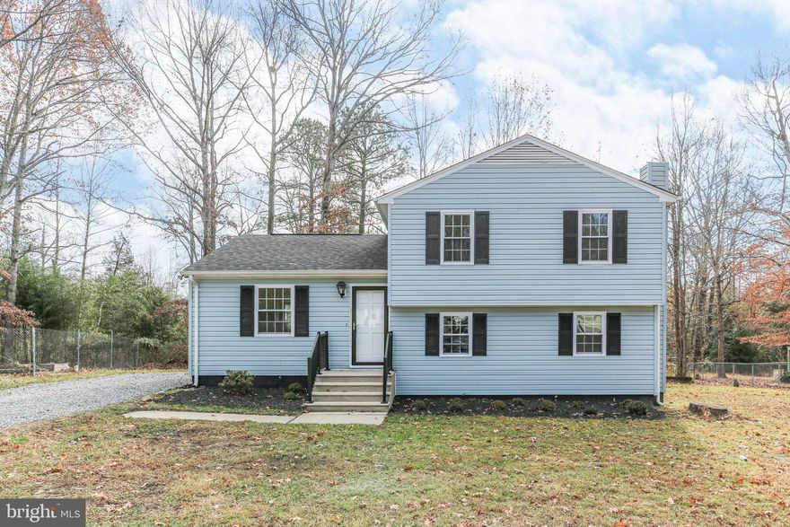 Tucked conveniently off Route 1 in Caroline County, this charming upgraded tri-level home offers both comfort and style, with the added bonus of NO HOA! Lovingly maintained and thoughtfully upgraded over the years, this home is truly move-in ready, featuring all-new flooring, fresh paint throughout, and a spacious, classic kitchen layout with an eat-in area. This home boasts 4 bedrooms, 2 full baths, kitchen and sitting room on main level, and a large, 12x22 foot recreational room on the basement level, perfect for entertaining. The kitchen, upgraded just 7 years ago, showcases deep cherry-toned cabinetry, warm neutral countertops, and sleek stainless steel appliances, creating a perfect blend of modern convenience with a timeless design. Additional recent updates include modern light fixtures, ceiling fans, new toilets and vanities, new LVP flooring, plus fresh plush carpeting and bright, inviting paint throughout. Outside, the home’s curb appeal shines with classic black shutters, new storm doors, and a 3-year-old architectural shingle roof, all beautifully contrasting the light blue vinyl siding. The yard is low-maintenance, freshly mulched, and the driveway has been updated with new gravel. The backyard features a large shed for extra storage and a freshly painted deck just off the kitchen, ideal for relaxing or outdoor entertaining. Location is key! This home offers an easy commute to Fredericksburg or Richmond, with quick access to I-95, and is just minutes from Kings Dominion and the new Kalahari Resort! This is a great move-in-ready gem!