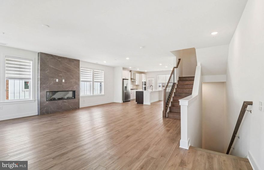 NEW CONSTRUCTION- This Upper 2-level Sydney end unit condo offering the space of a single-family home where every space is thoughtfully considered. The home offers 3 Bedrooms, 2.5 Bathrooms, a Study, 1-Car Garage & 1 Car Driveway. A Rooftop Terrace with Fireplace, the Main Level boasts an Extended Balcony with Fireplace off the Kitchen, open floorplan with a private Study, and a huge walk-in Pantry. The Gourmet Kitchen is spacious and is complete with a Quartz Island with White Cabinets. This home includes Whirlpool Stainless Steel Appliances with a 5-Burner Gas Cooktop, a Chimney Vented Hood and a Wall Oven/Microwave. The Owner's Suite has 2 large walk-in closets, a walk-in shower with seat,  frameless glass door, and a separate water closet and linen closet. This home has an EV rough-in plug and upgraded wiring package.  Oak stairs all the way up to the bedroom level and 7" wide LVP on the main level.